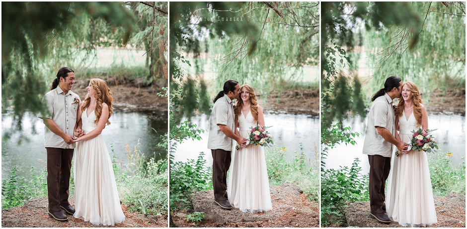 Beautiful bride and groom formals outdoors in front of a pond surrounded my aspen and evergreen trees. 