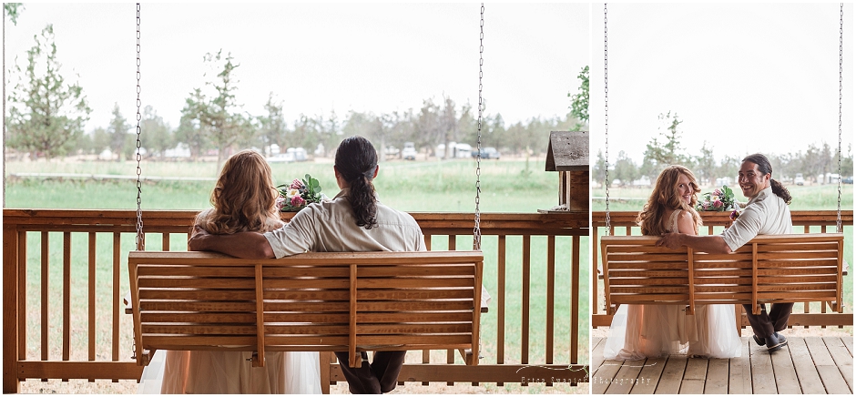 The bride & groom sit on a beautiful wooden porch swing overlooking the ranch and outdoors in Bend Oregon. 