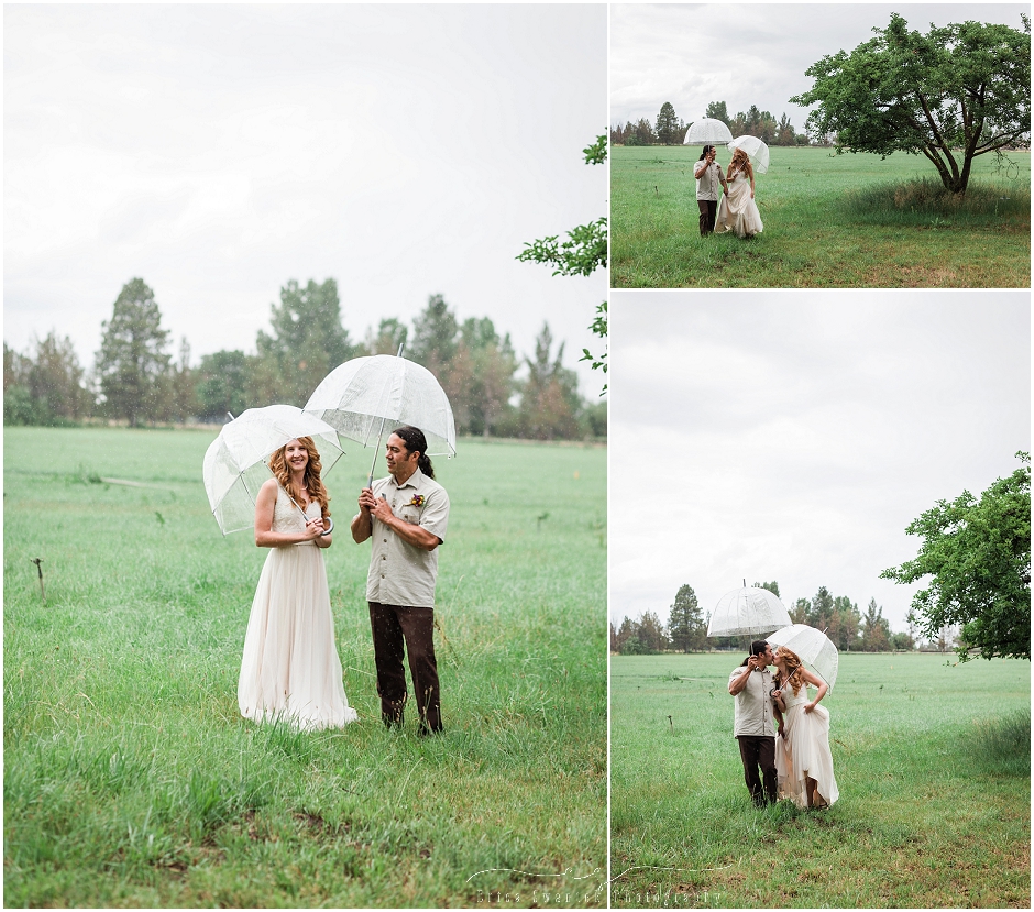 The bride and groom enjoy a few moments out in the rain under the cover of some clear umbrellas. 