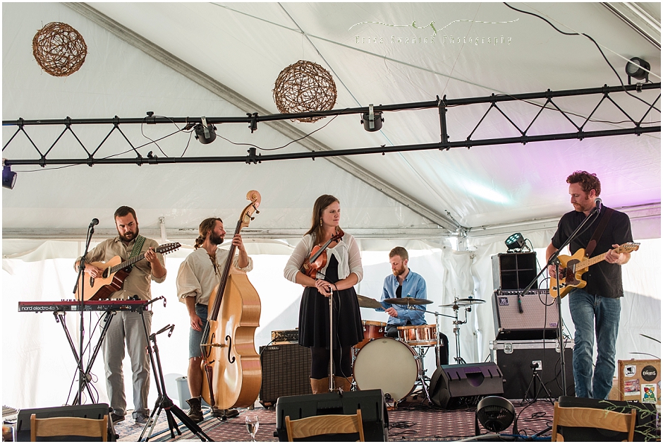 Polecat, a 5 piece bluegrass band featuring a drummer, keyboard/guitar, guitar, upright bass and a female fiddle player entertain guests at the rustic Oregon ranch wedding. 