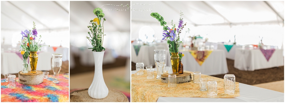 Gorgeous colorful flowers fill vintage vases with rustic aspen tree stands on the tables of this backyard wedding. 