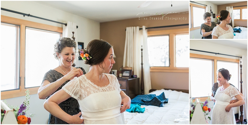 Lovely smile from a mom as she watches her daughter put on her vintage wedding gown at this Sisters, OR wedding. 