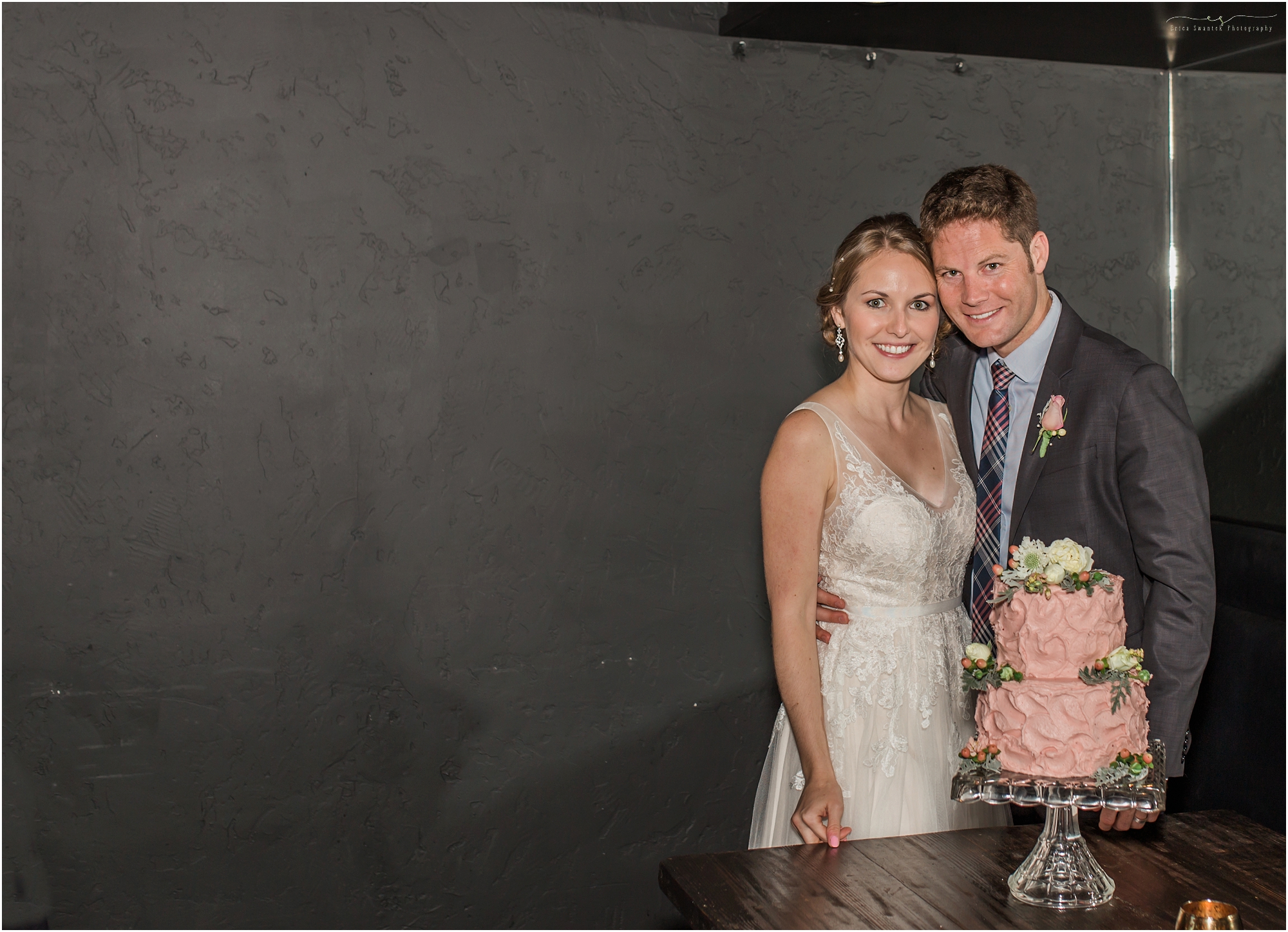 A beautiful bride and groom with their cake created by Faith and Flour in Redmond, OR.