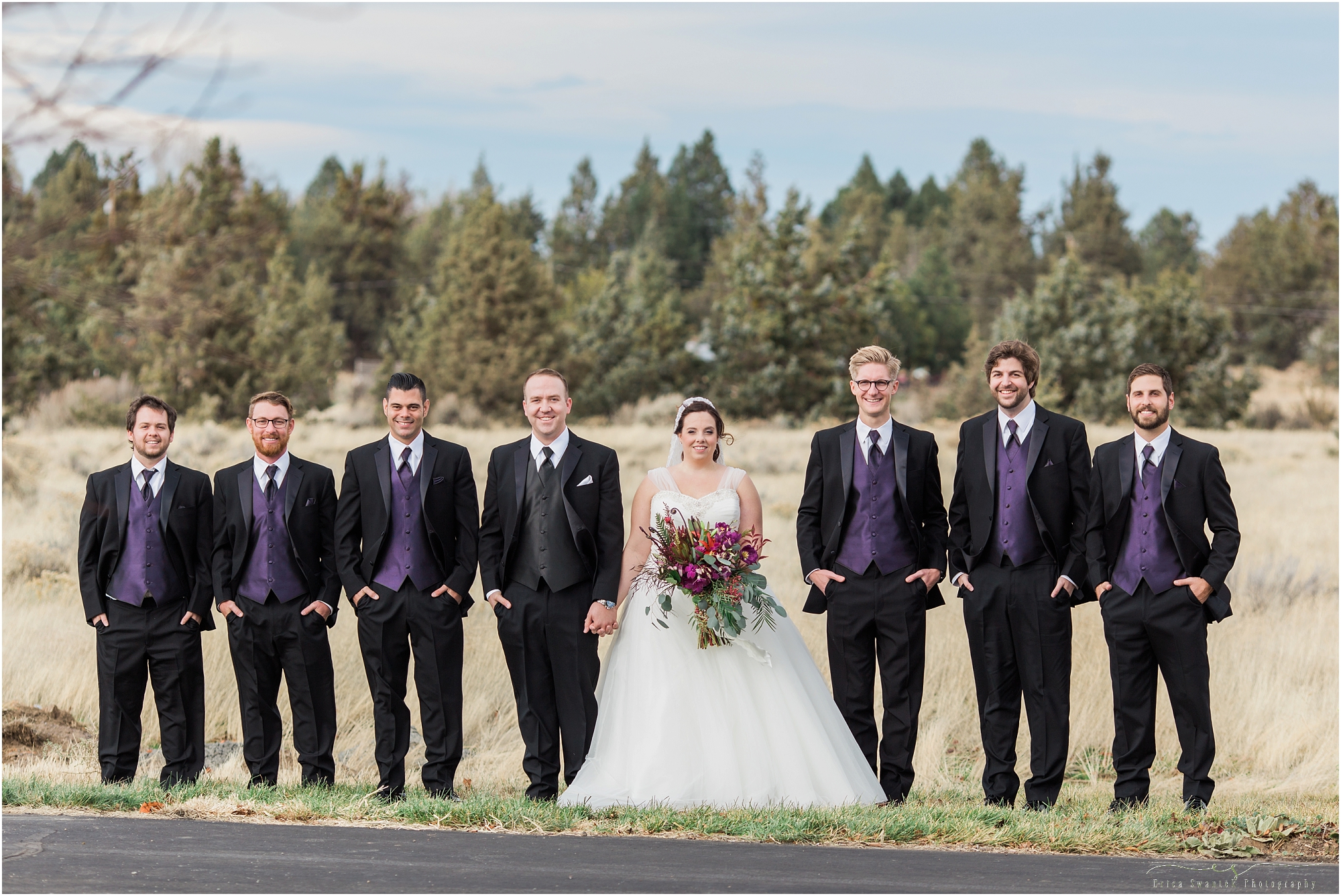 The bride and groom pose with the groomsmen outside of Bend's Seventh Day Adventist Church. 