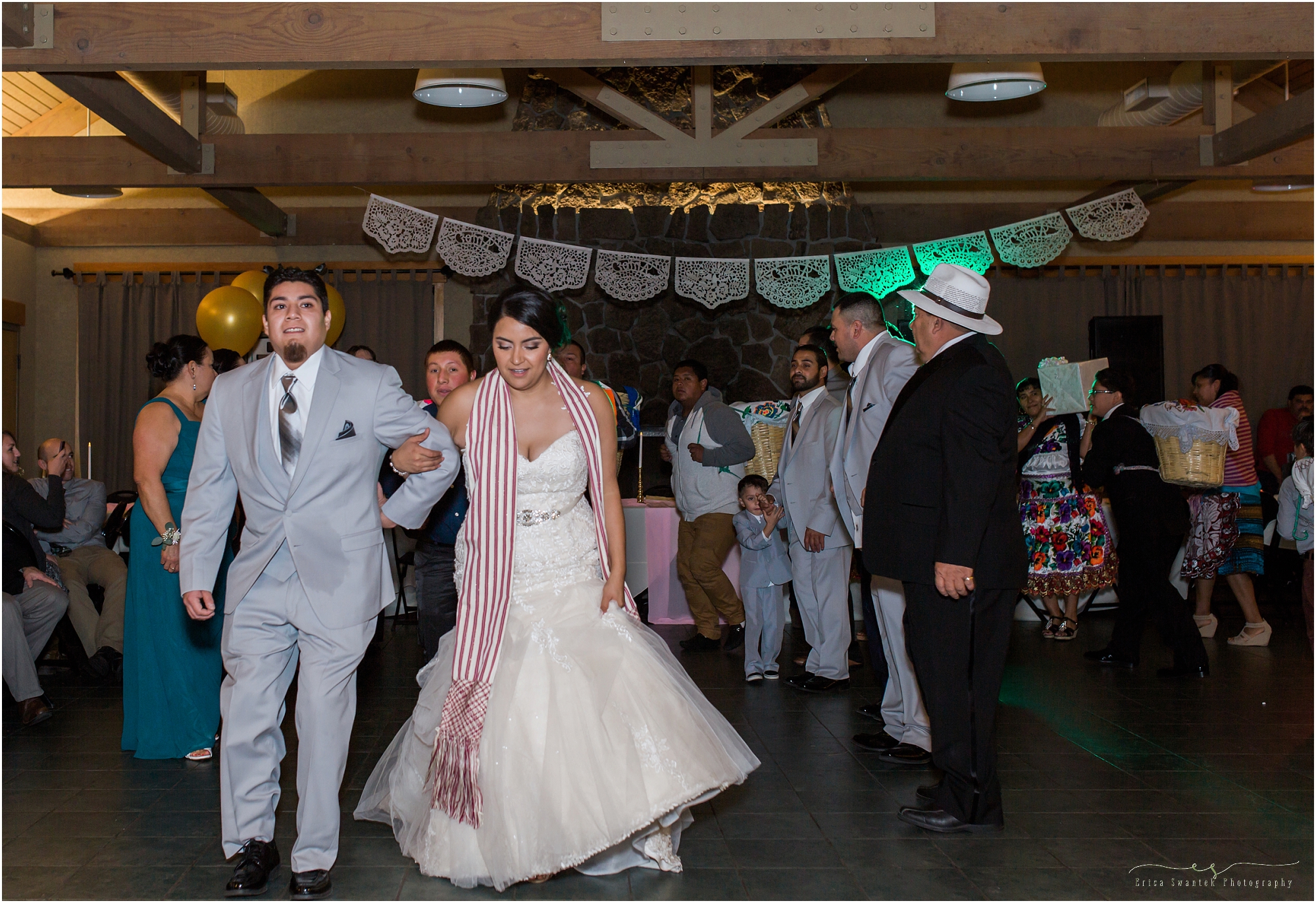 An amazing Mexican cultural tradition with a dance line and baskets of gifts to shower the newly wedded couple at this Aspen Hall outdoor Oregon wedding in Bend. 