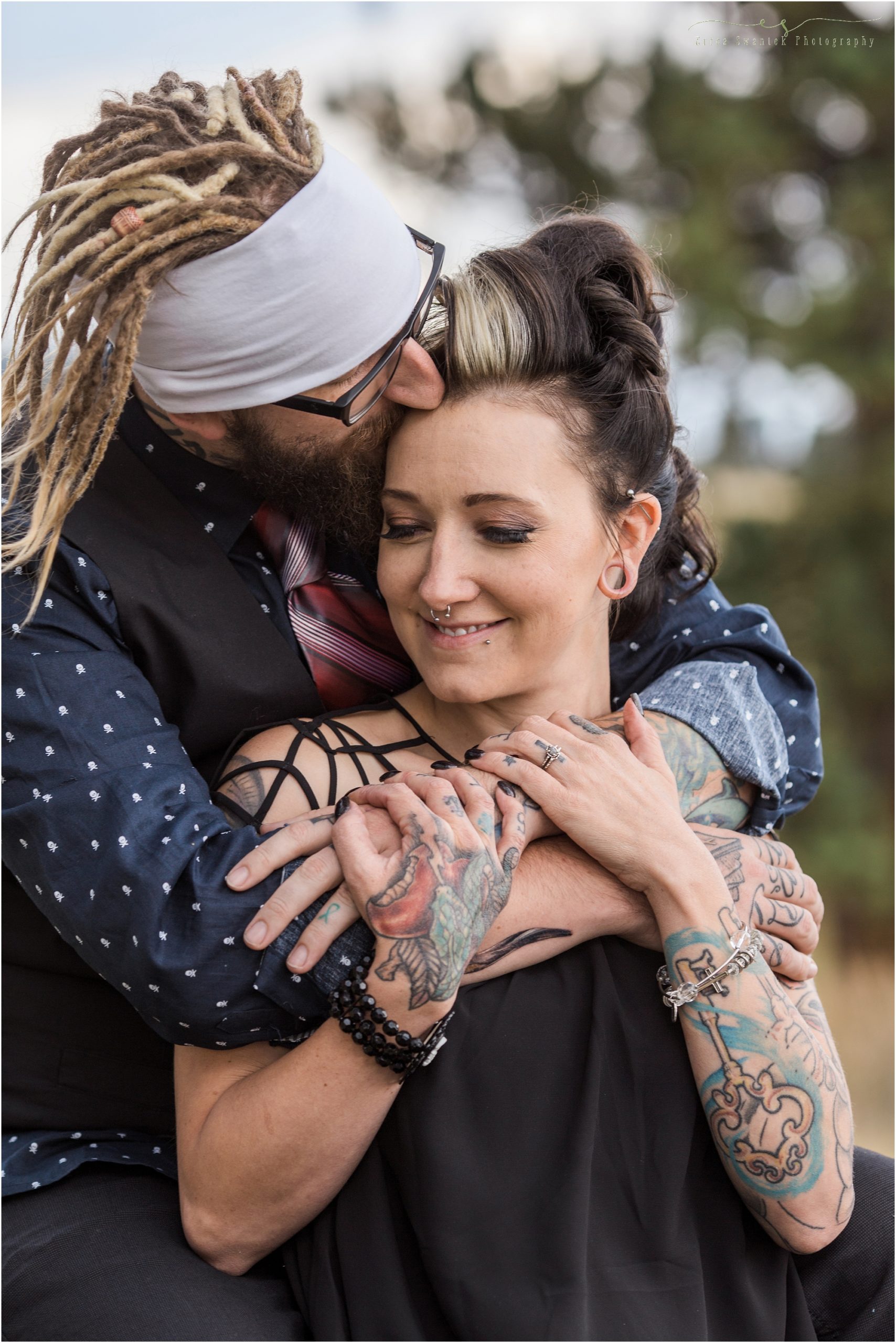 A tattooed couple embraces for their engagement session. | Erica Swantek Photography