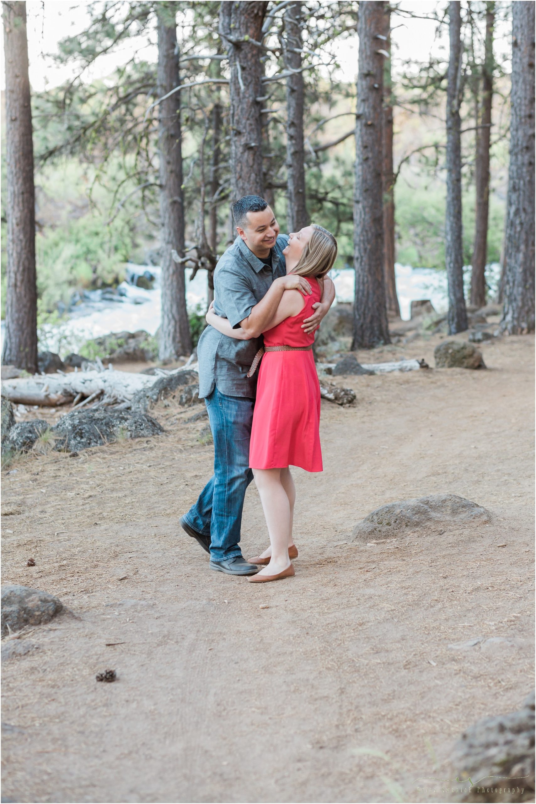A couple falls over each other in laughter during their engagement photo shoot by Bend, OR photographer Erica Swantek. 