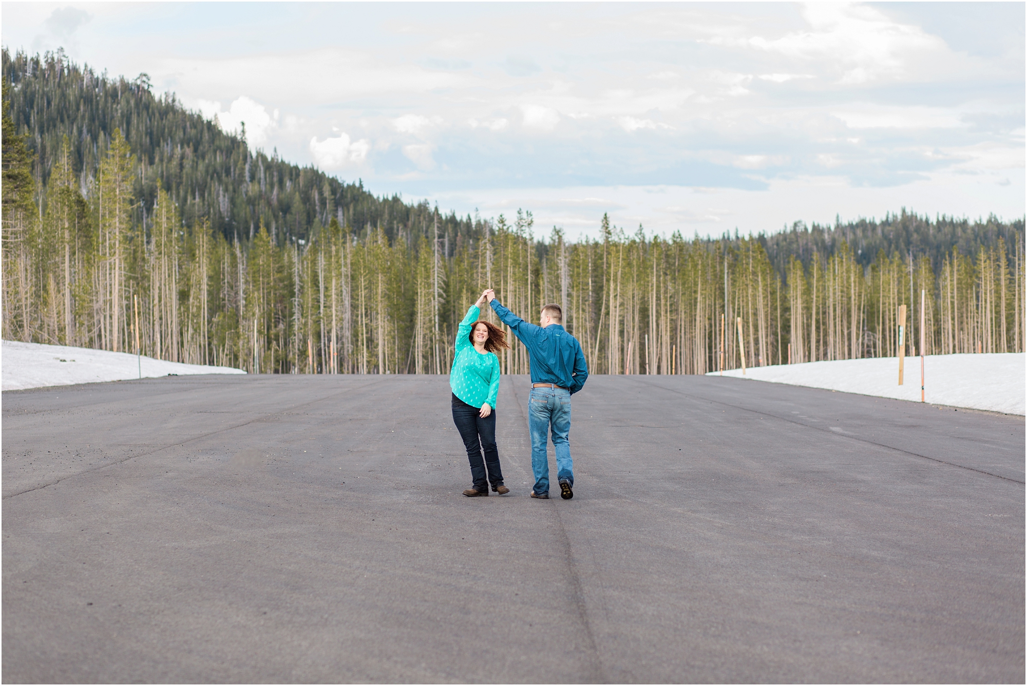 An empty sno park parking lot makes a beautiful dance floor at this classic Bend Oregon engagement session. 