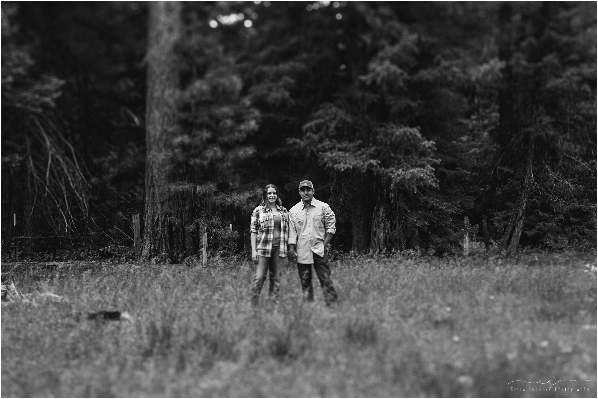 A moody black and white engagement session picture in the thick forest of the Ochoco National Forest in Oregon. | Erica Swantek Photography