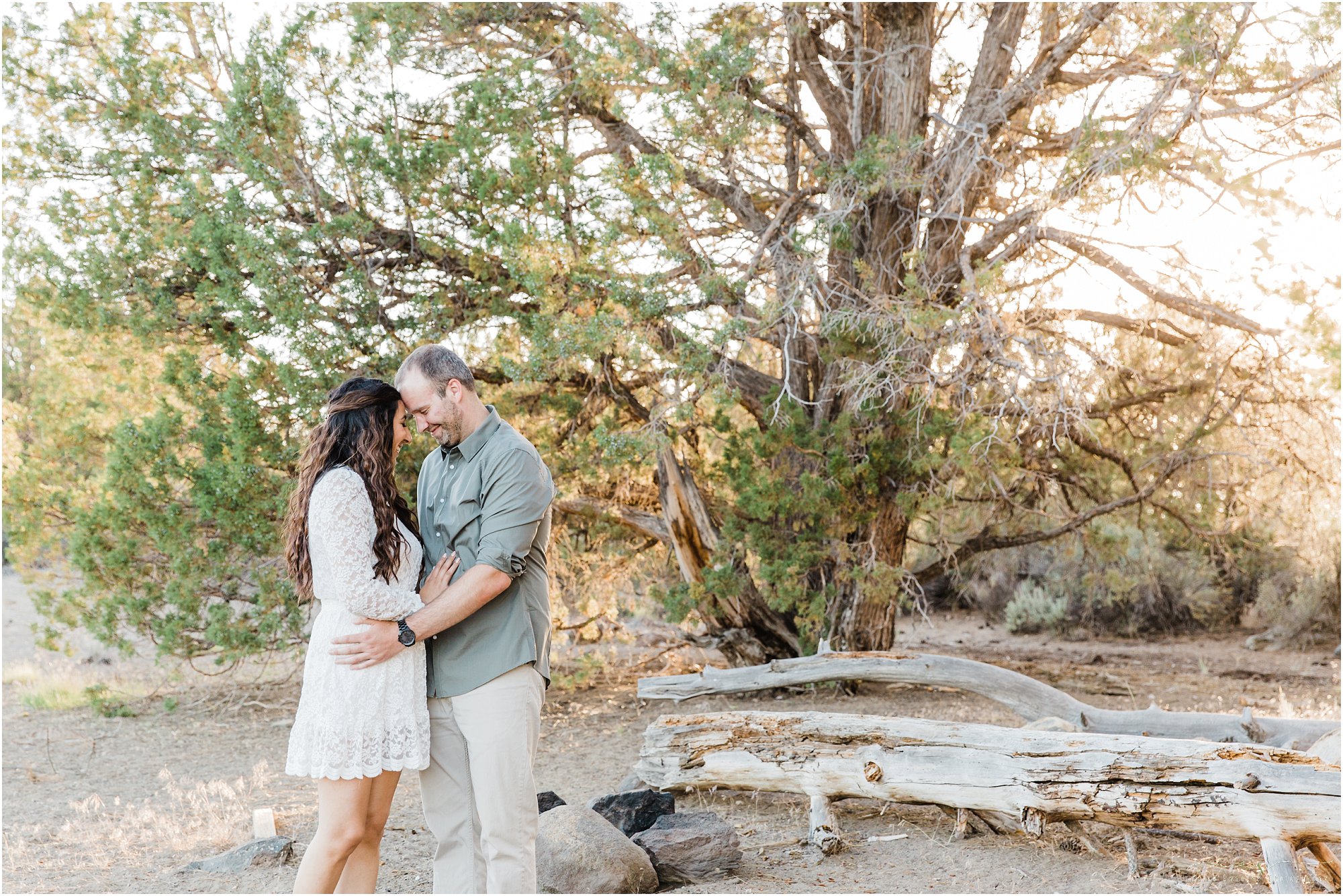 The sun peeks through the Juniper trees at this gorgeous Tumalo Falls engagement photos session near Bend, OR. | Erica Swantek Photography