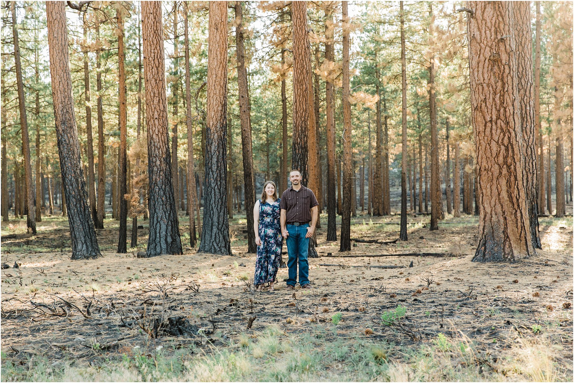 A happy engaged couple poses for their Bend Oregon engagement photos at Shevlin Park. | Erica Swantek Photography