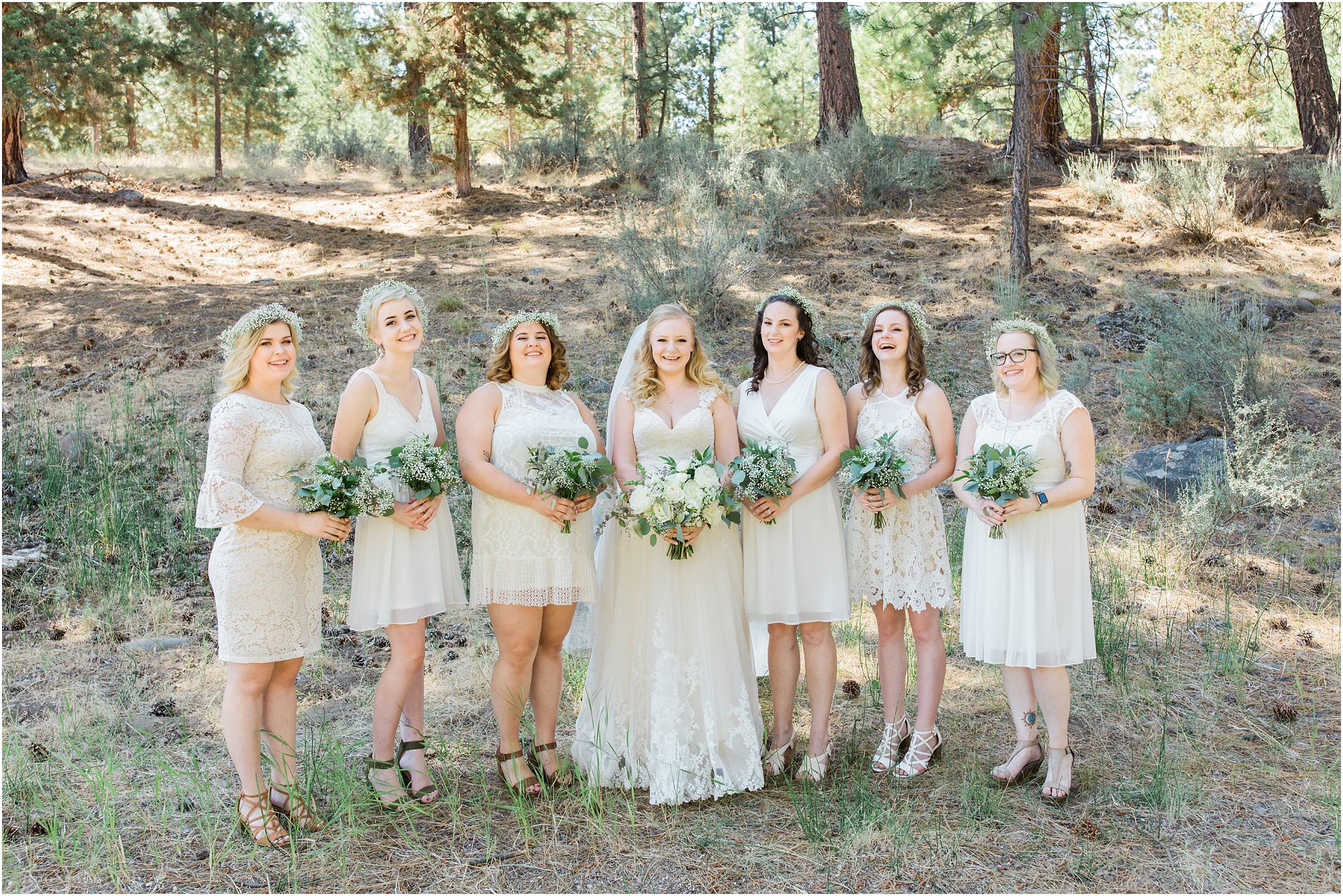 Stunning bride and her bridesmaids wearing all white for this vintage rustic chic Bend wedding theme at Aspen Hall. | Erica Swantek Photography
