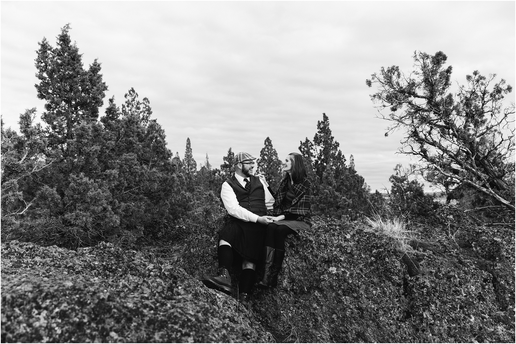 A black and white image of gorgeous Bend Oregon engagement session with the groom wearing a kilt. | Erica Swantek Photography