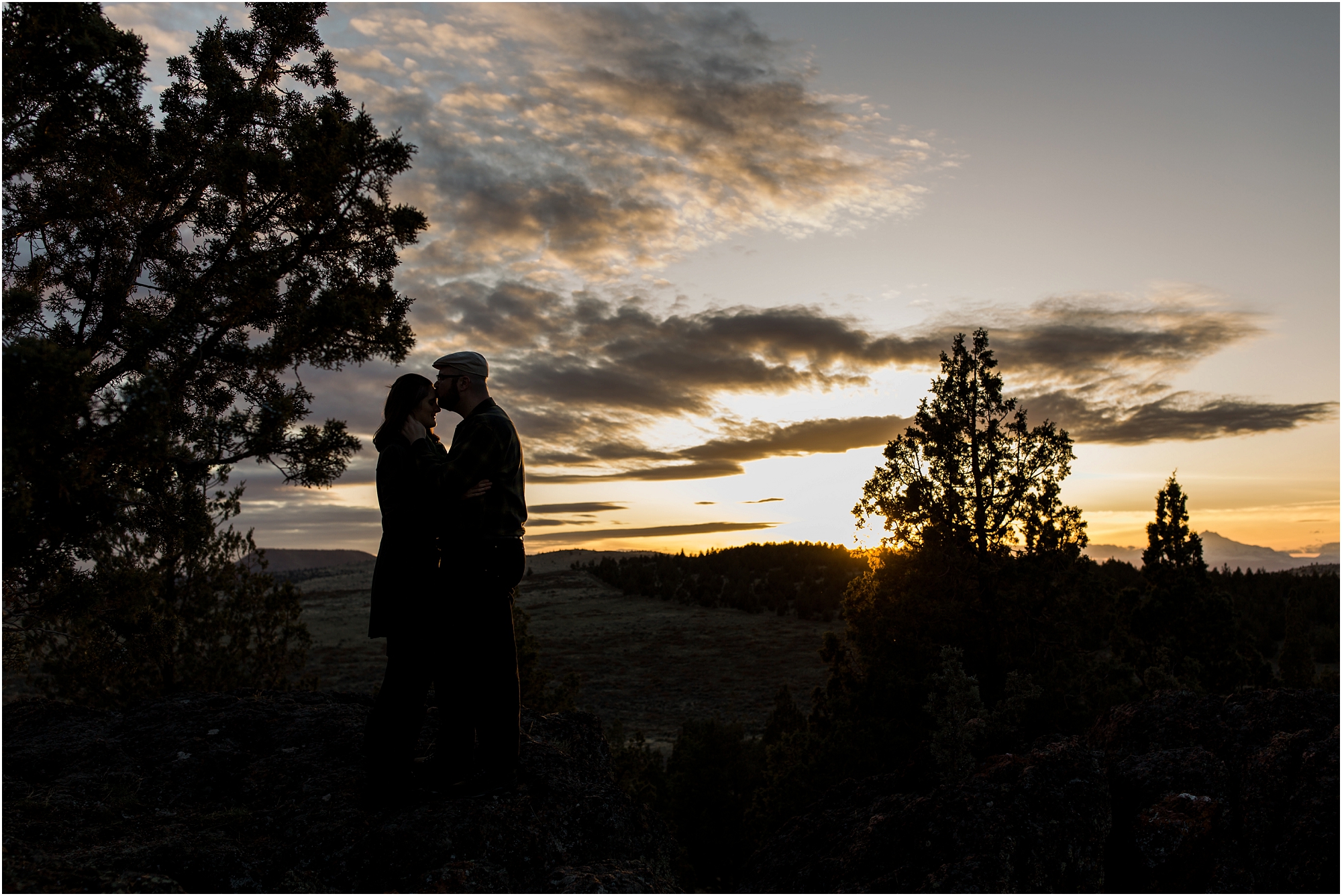 A beautiful silhouette of an engaged couple in the Oregon desert near Bend. | Erica Swantek Photography
