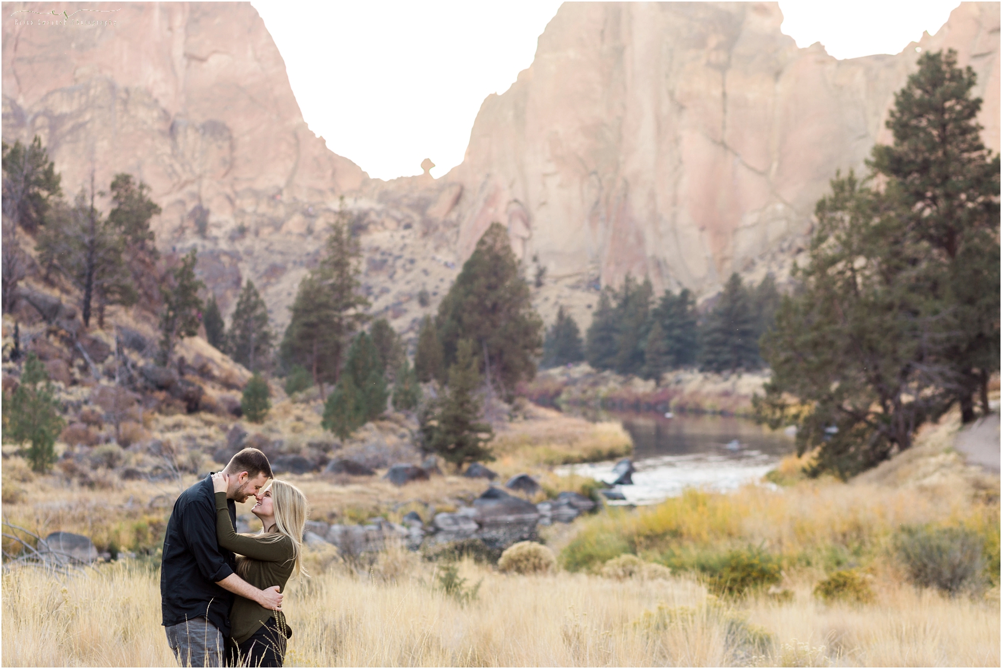An adventurous couple poses along the Crooked River for the engagement photos at Smith Rock State Park in Oregon. | Erica Swantek Photography
