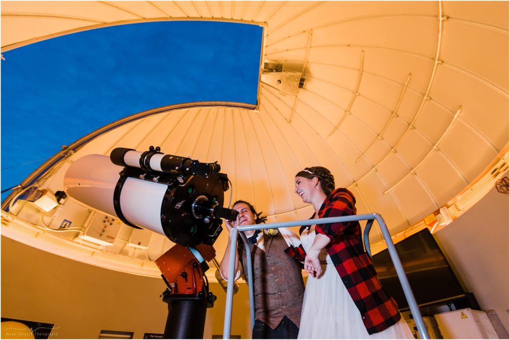 A bride & groom get a private showing of the Hopservatory where they view Saturn on the evening of their Worthy Brewing Wedding in Bend Oregon. | Erica Swantek Photography