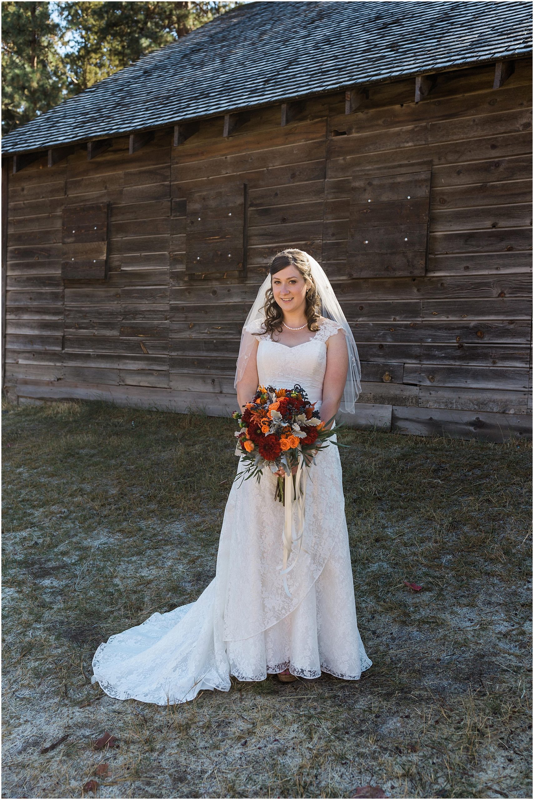 A bride poses for a bridal portrait at her Hollinshead Barn Fall Wedding in Bend, OR. | Erica Swantek Photography