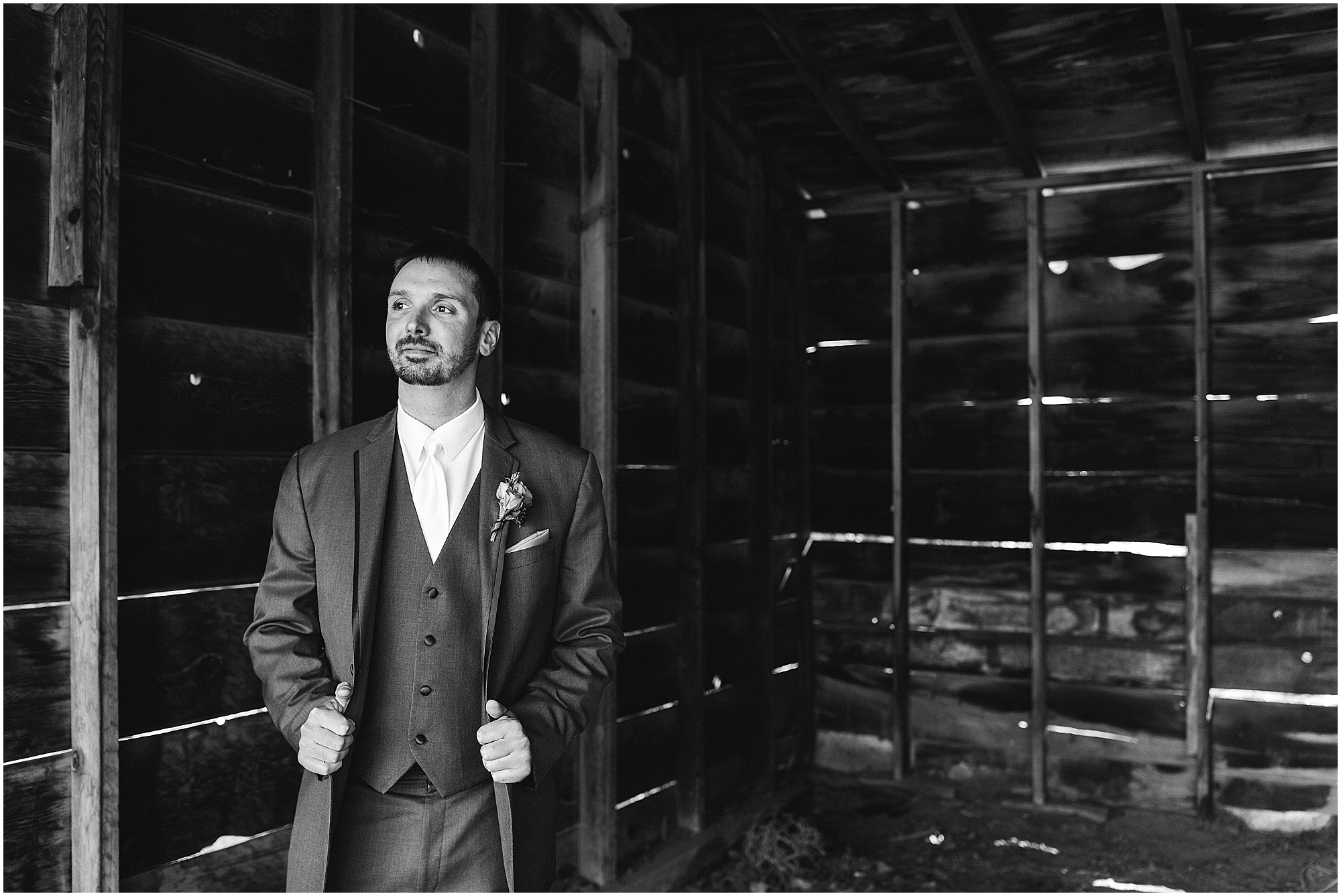 A gorgeous classic black and white image of a groom wearing a Vera Wang suit at his Hollinshead Barn Fall Wedding in Bend, Oregon. | Erica Swantek Photography