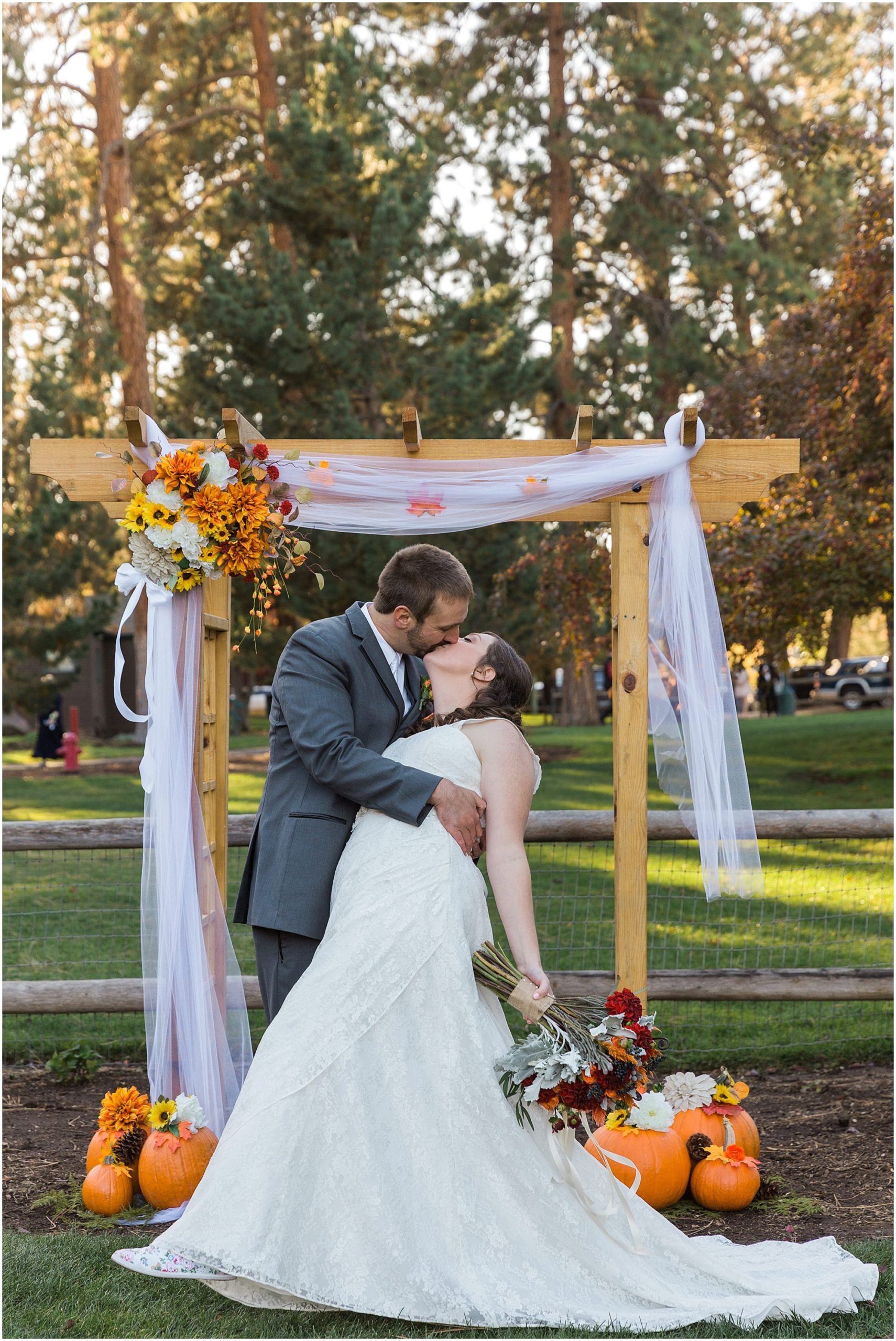 The groom dips his bride for a kiss at their Hollinshead Barn fall wedding in Bend, OR. | Erica Swantek Photography