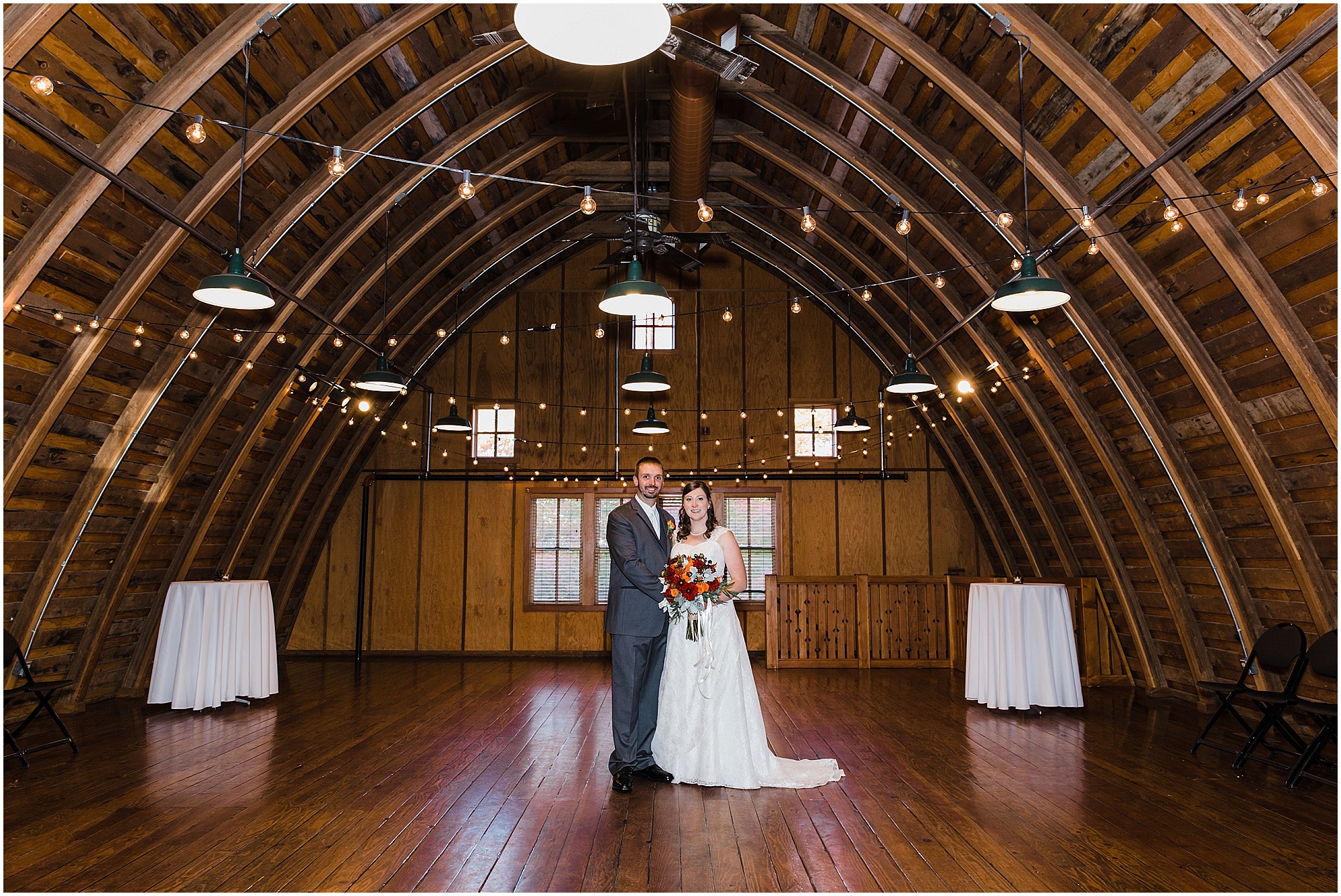 The hardwood interior of the historic Hollinshead Barn is a beautiful place for a formal wedding portrait in Bend, OR. | Erica Swantek Photography