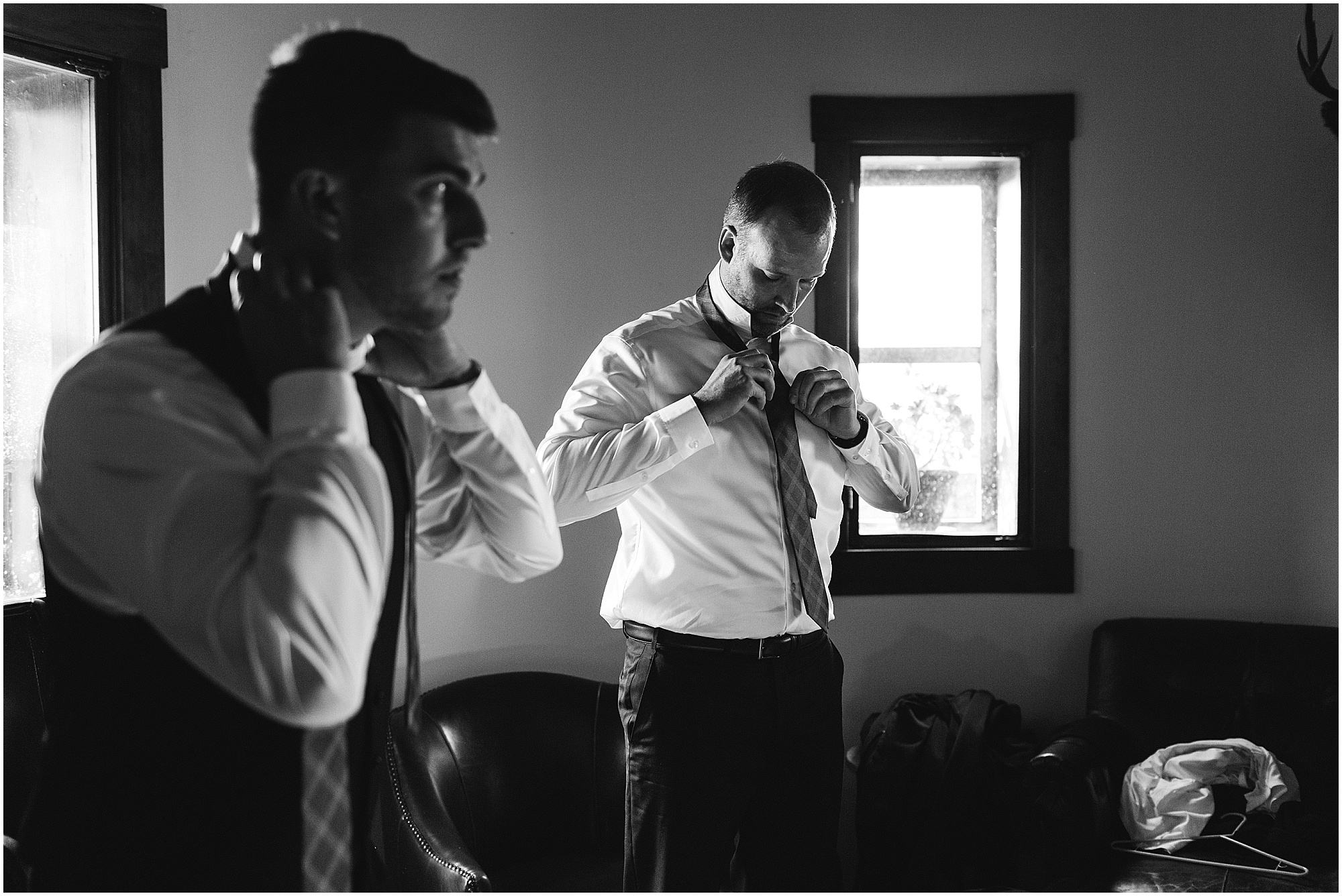 Groom and groomsmen getting dressed before a gorgeous wedding at the Tuscan Stables at Ranch at the Canyons venue in Central Oregon. | Erica Swantek Photography