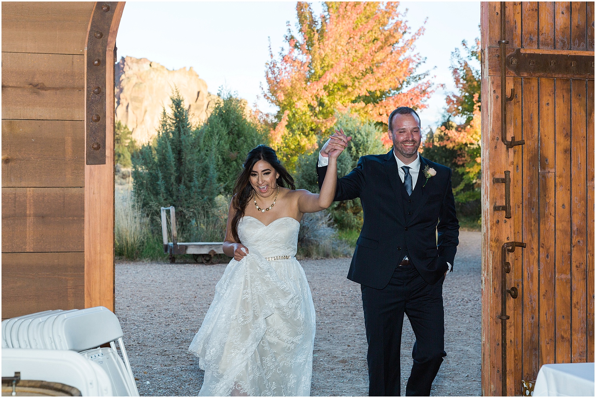 The wedding couple makes their grand entrance at their Ranch at the Canyons fall wedding in Central Oregon. | Erica Swantek Photography
