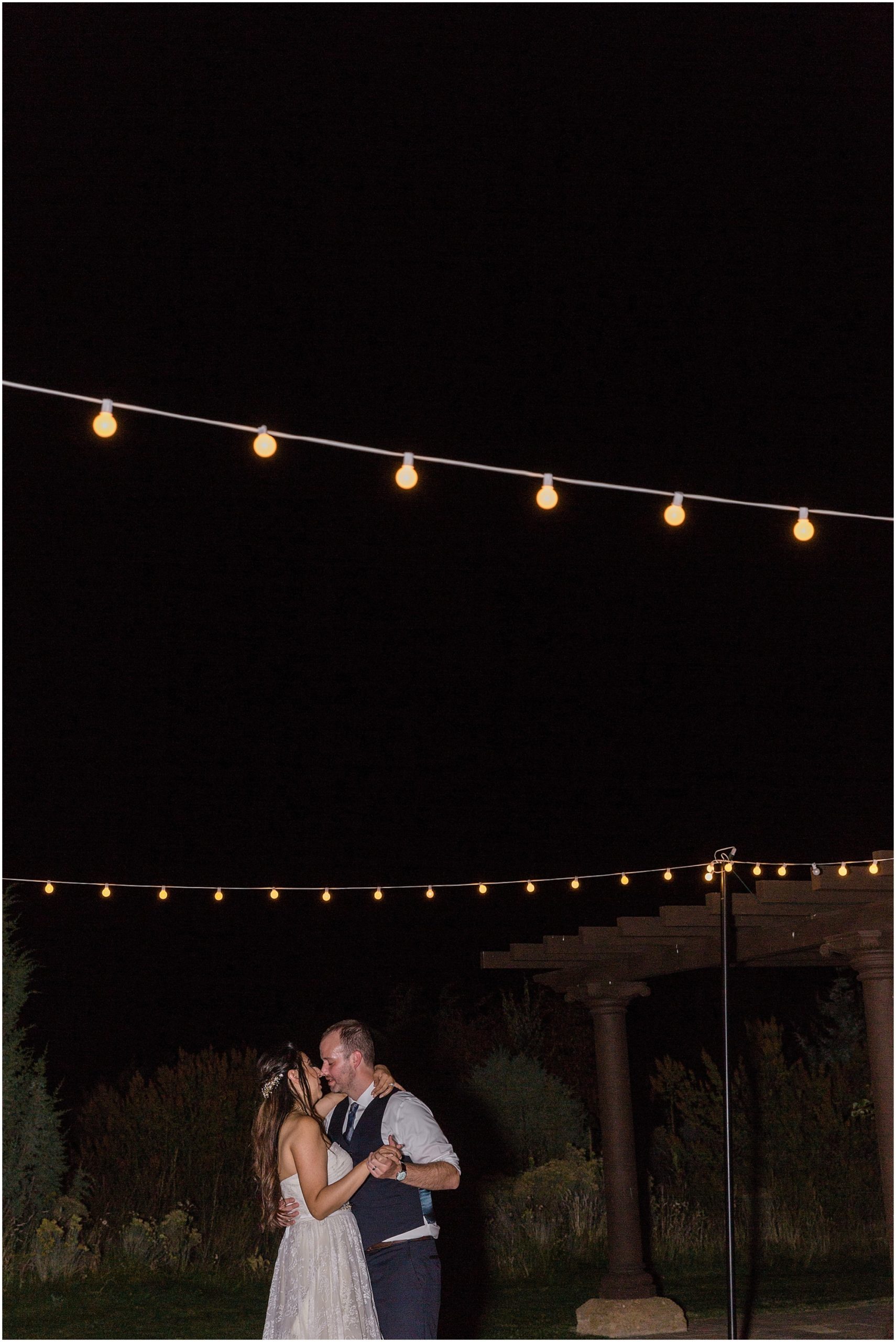 A romantic dance with a newly married couple under their string lights at their Ranch at the Canyons fall wedding in Oregon. | Erica Swantek Photography
