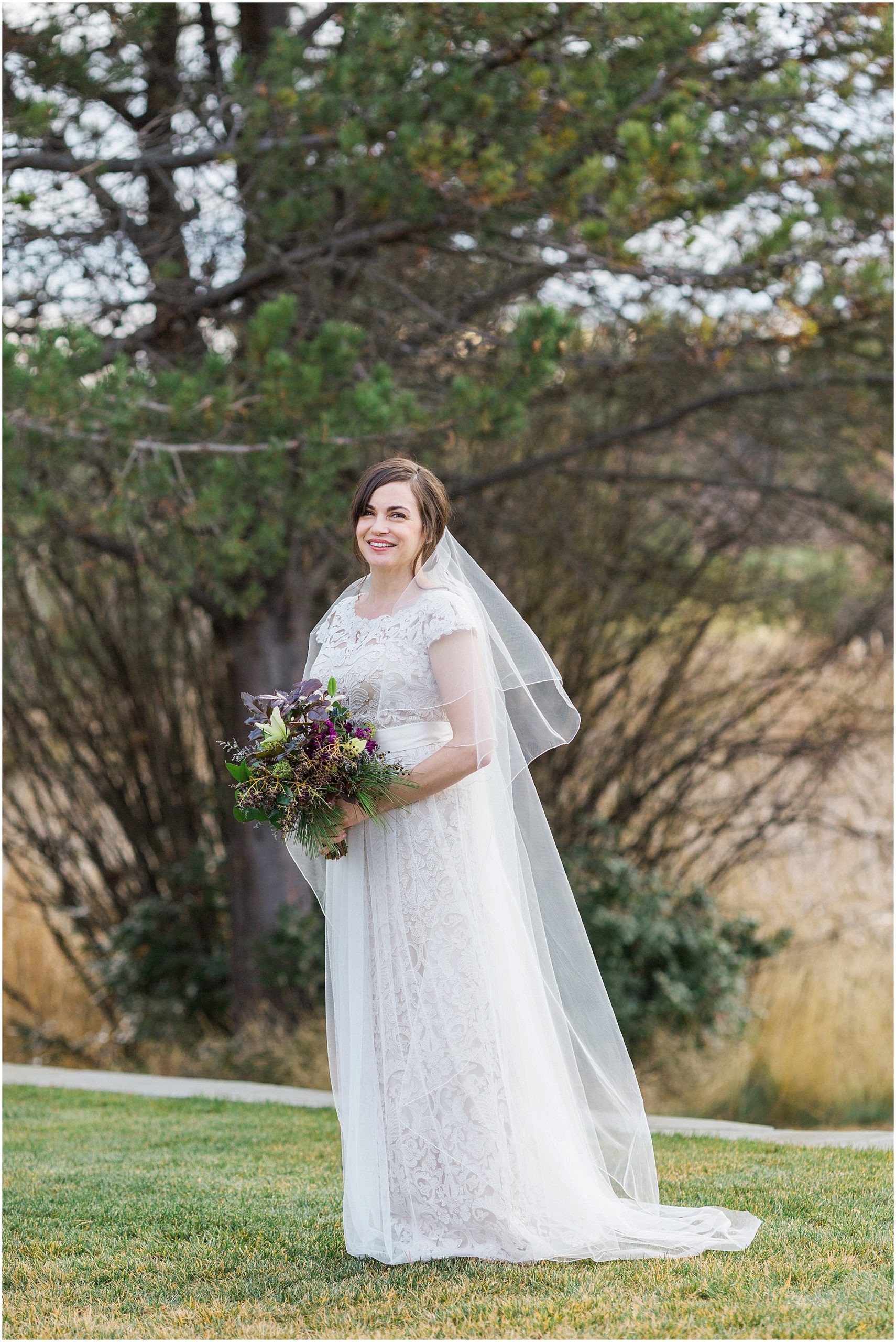 A stunning bride wearing a gorgeous cap sleeved lace gown. Perfect for her winter wedding at Sunriver Resort in Oregon. | Erica Swantek Photography