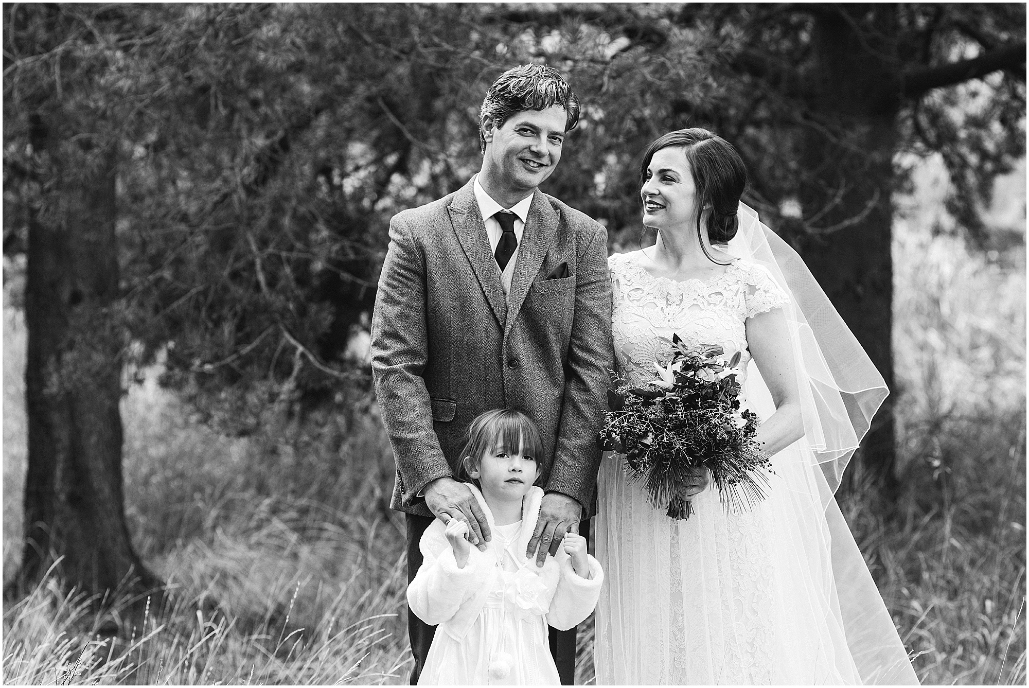 A beautiful black and white portrait of a couple and their daughter at this Sunriver Resort Winter wedding near Bend, OR. | Erica Swantek Photography