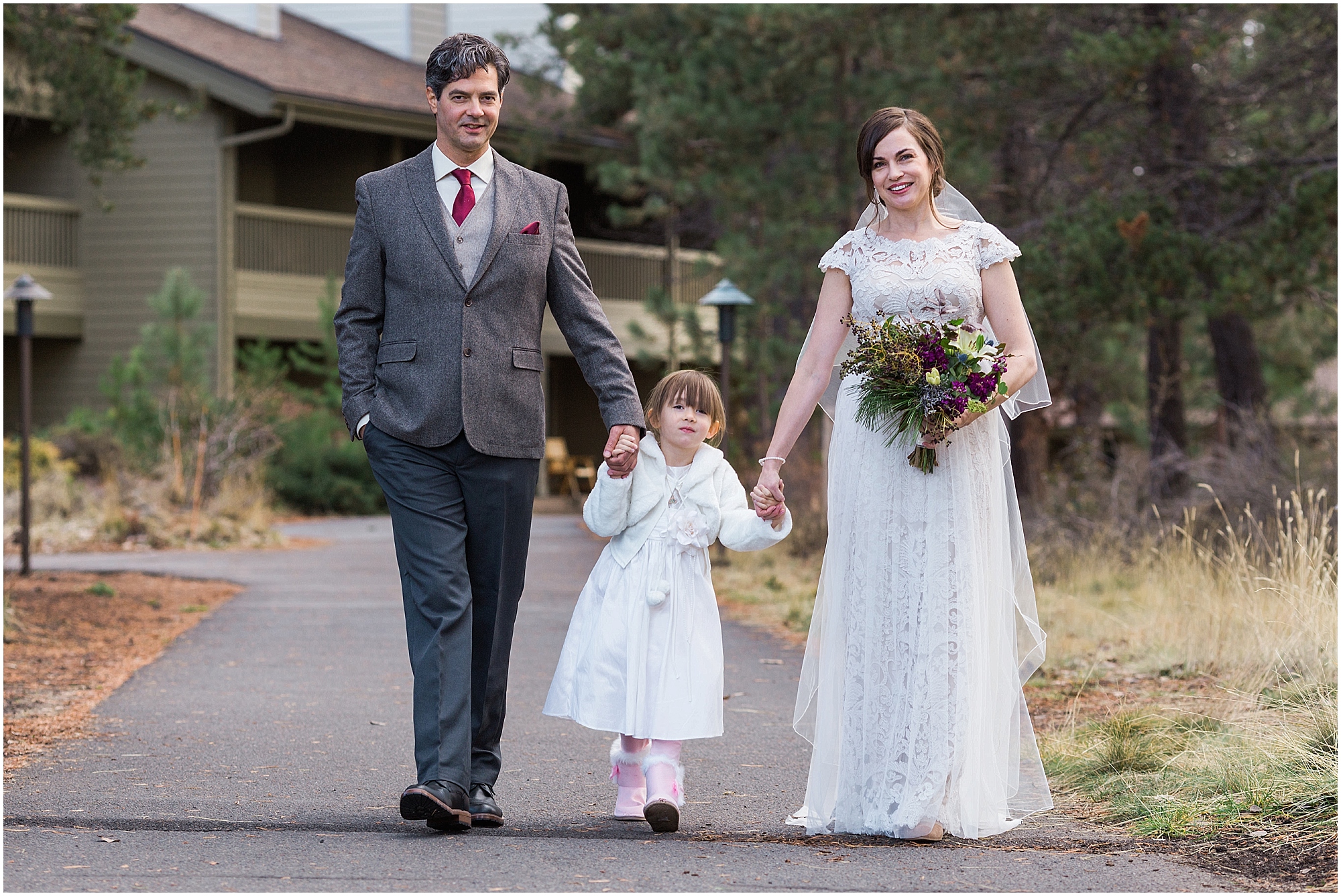 A family of three poses for a portrait during their Sunriver Resort winter wedding in Oregon. | Erica Swantek Photography