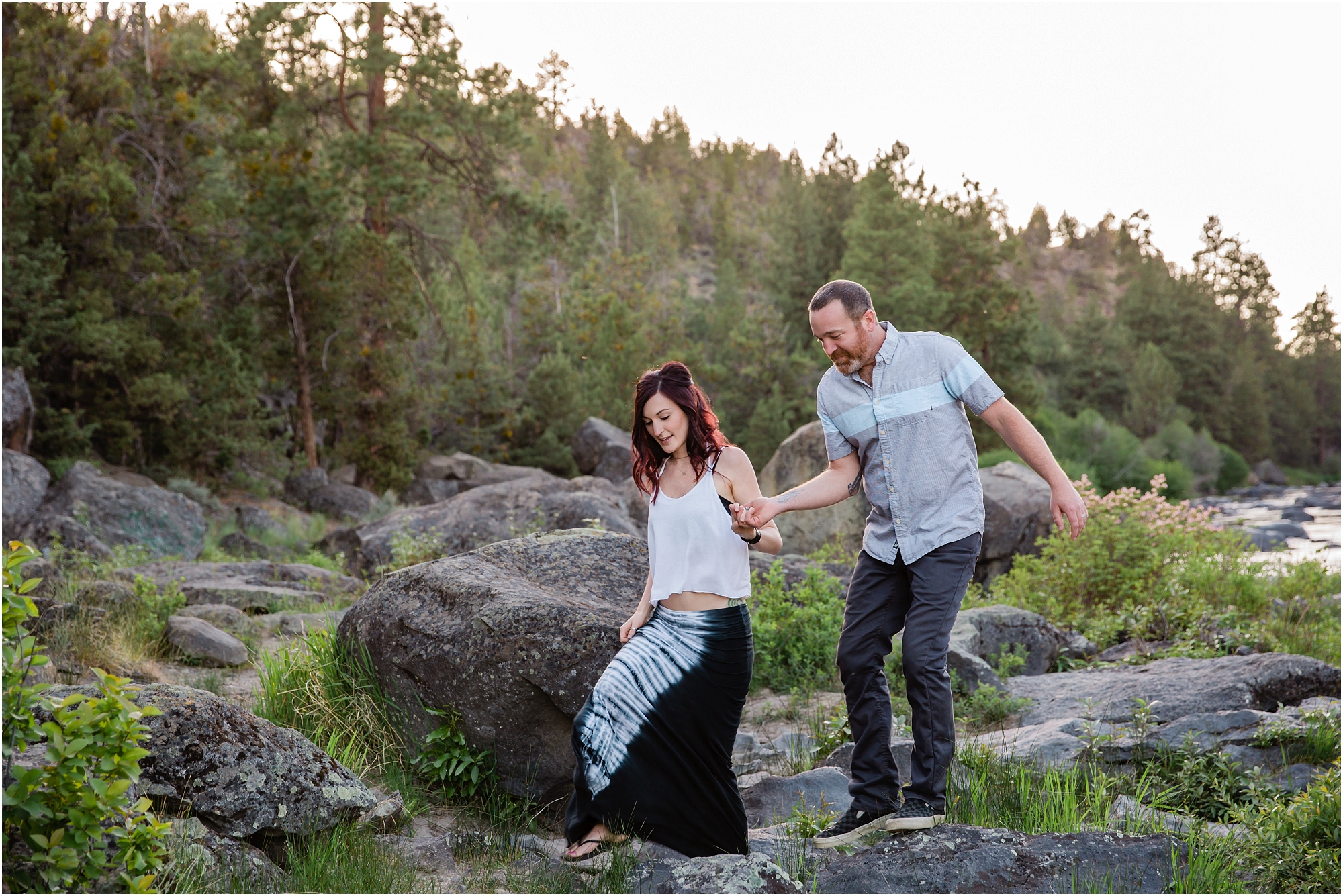 A gorgeous adventurous couple walks along the Deschutes River during their engagement session in Bend, OR. | Erica Swantek Photography