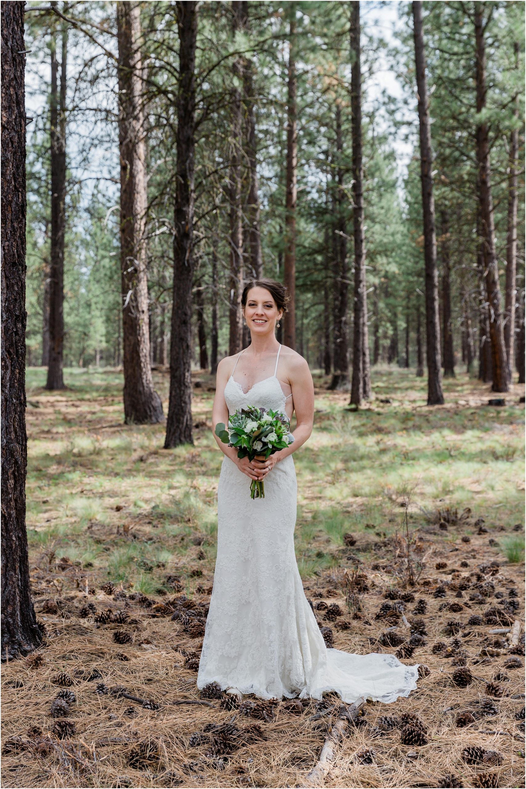 A gorgeous bride, wearing BHLDN, poses with her bouquet of succulents at the High Desert Museum wedding venue in Bend, OR. | Erica Swantek Photography