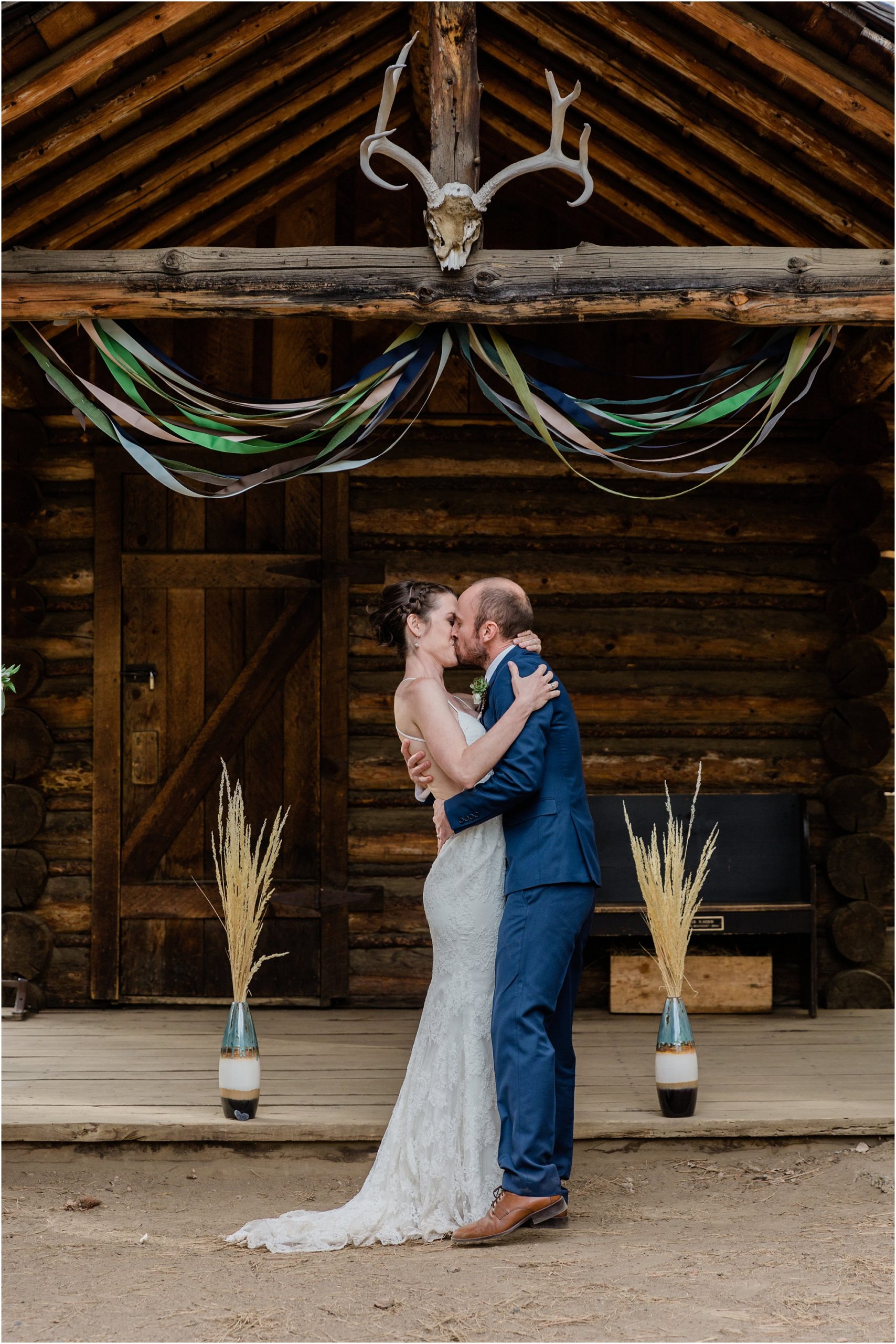 The couple kisses to seal the deal as they marry at their rustic outdoor wedding in Bend, OR. | Erica Swantek Photography