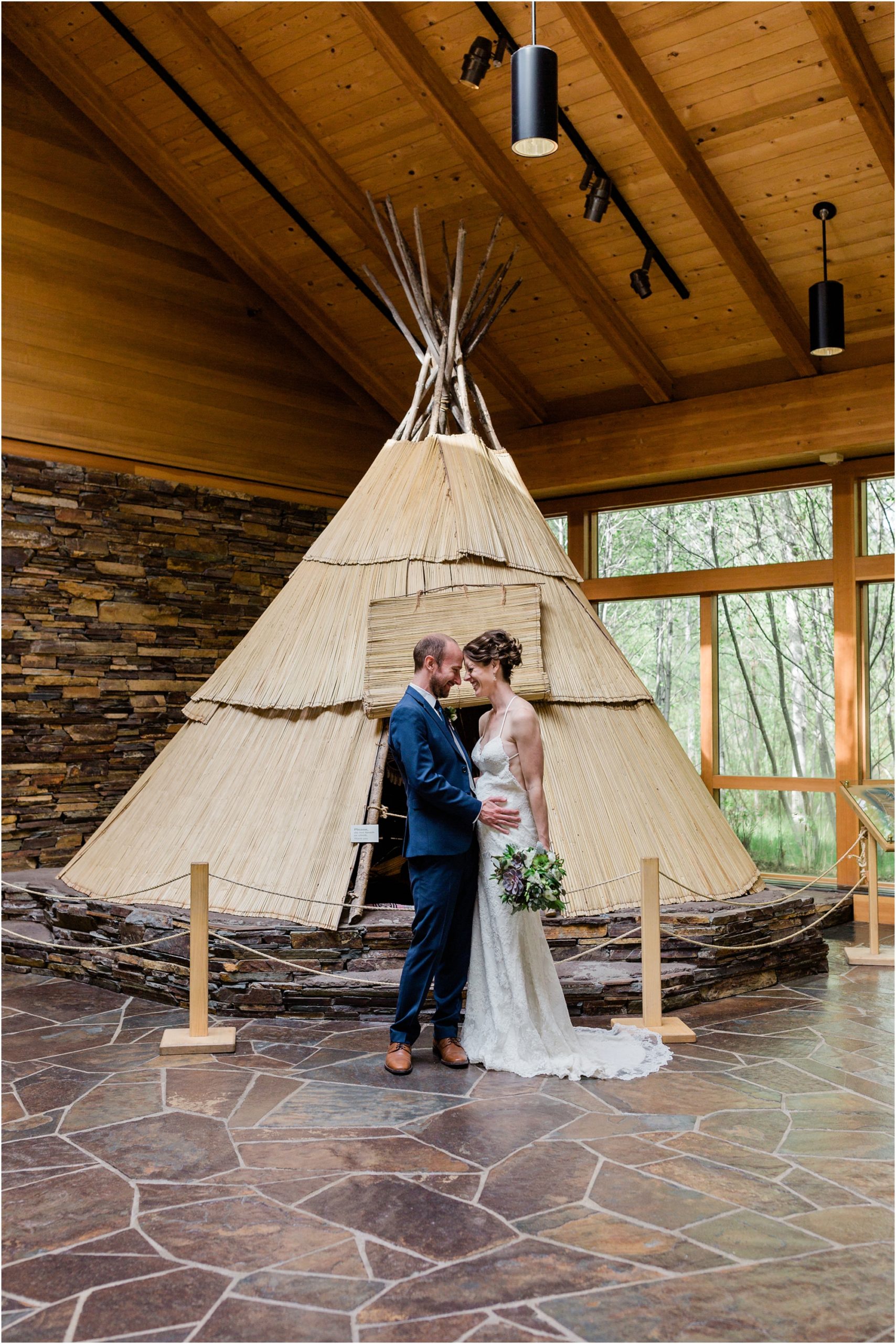 The tepee inside the High Desert Museum is a lovely background for a bride and groom to pose during their wedding celebration at the High Desert Museum in Oregon. | Erica Swantek Photography