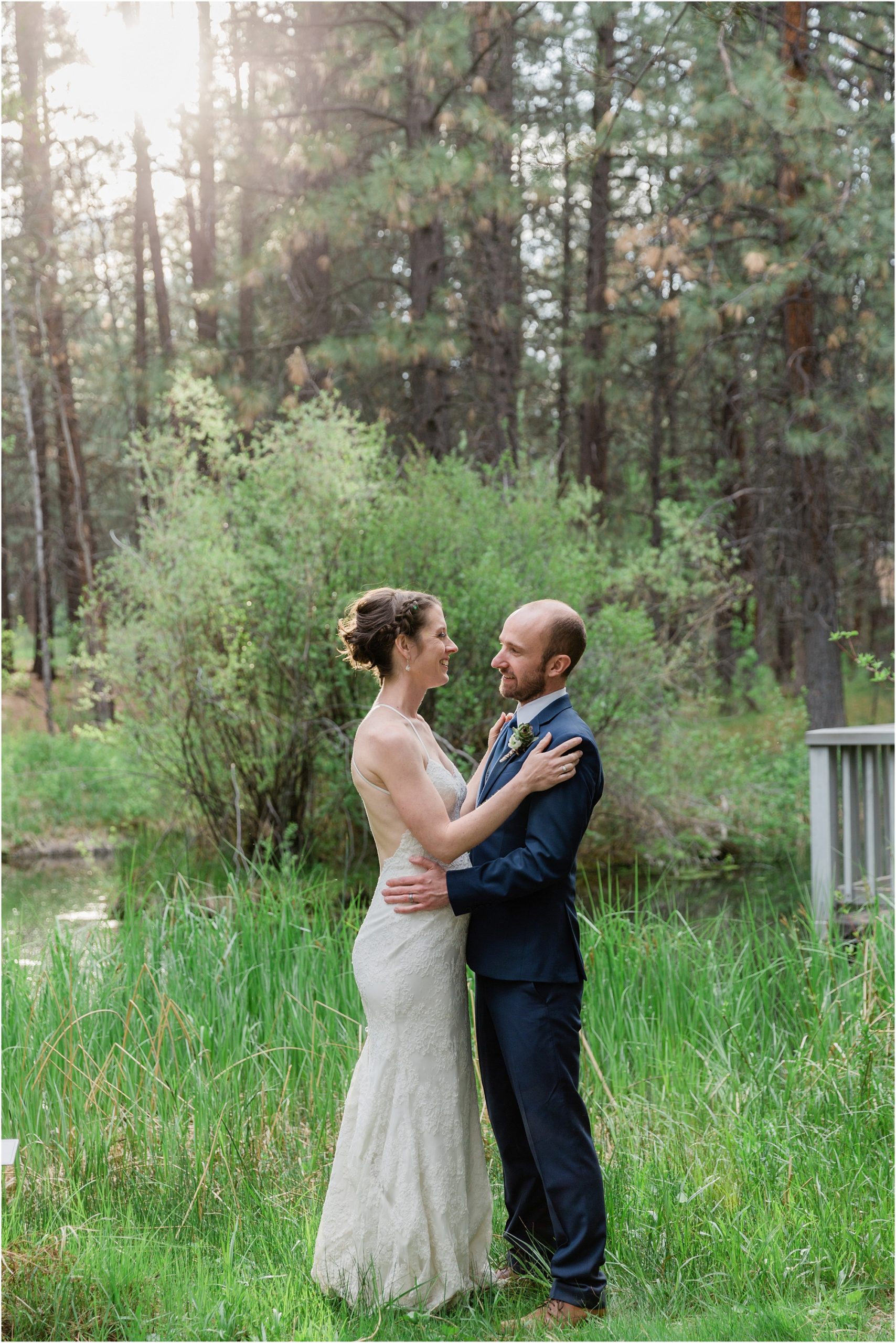 A newly married couple poses together amongst the pines and water feature at the gorgeous High Desert Museum wedding venue in Bend, OR. | Erica Swantek Photography