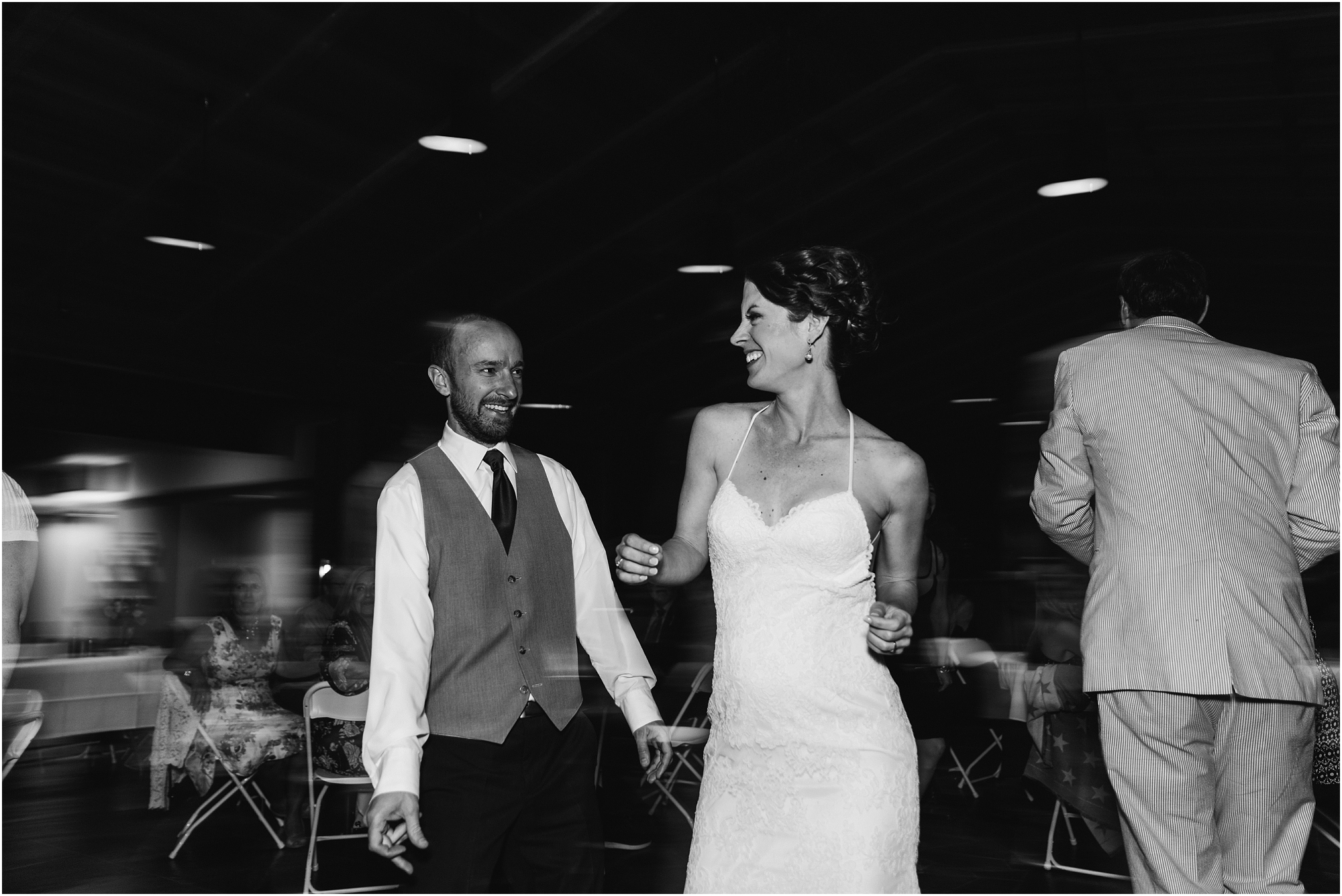 A beautiful black and white image of the wedding couple dancing to the Moon Mountain Ramblers in Bend, OR. | Erica Swantek Photography