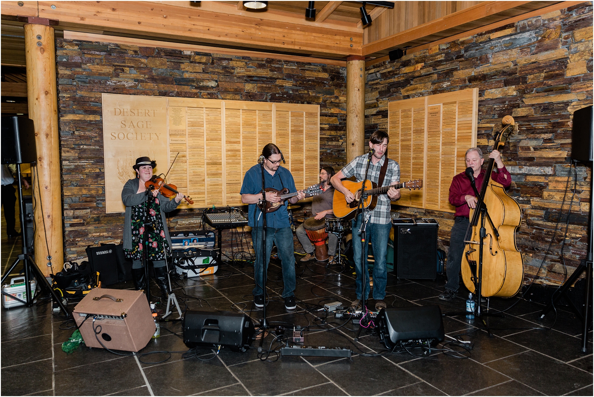 Bend, Oregon's Moon Mountain Ramblers plays a host of bluegrass tunes for wedding guests at the High Desert Museum in Oregon. | Erica Swantek Photography