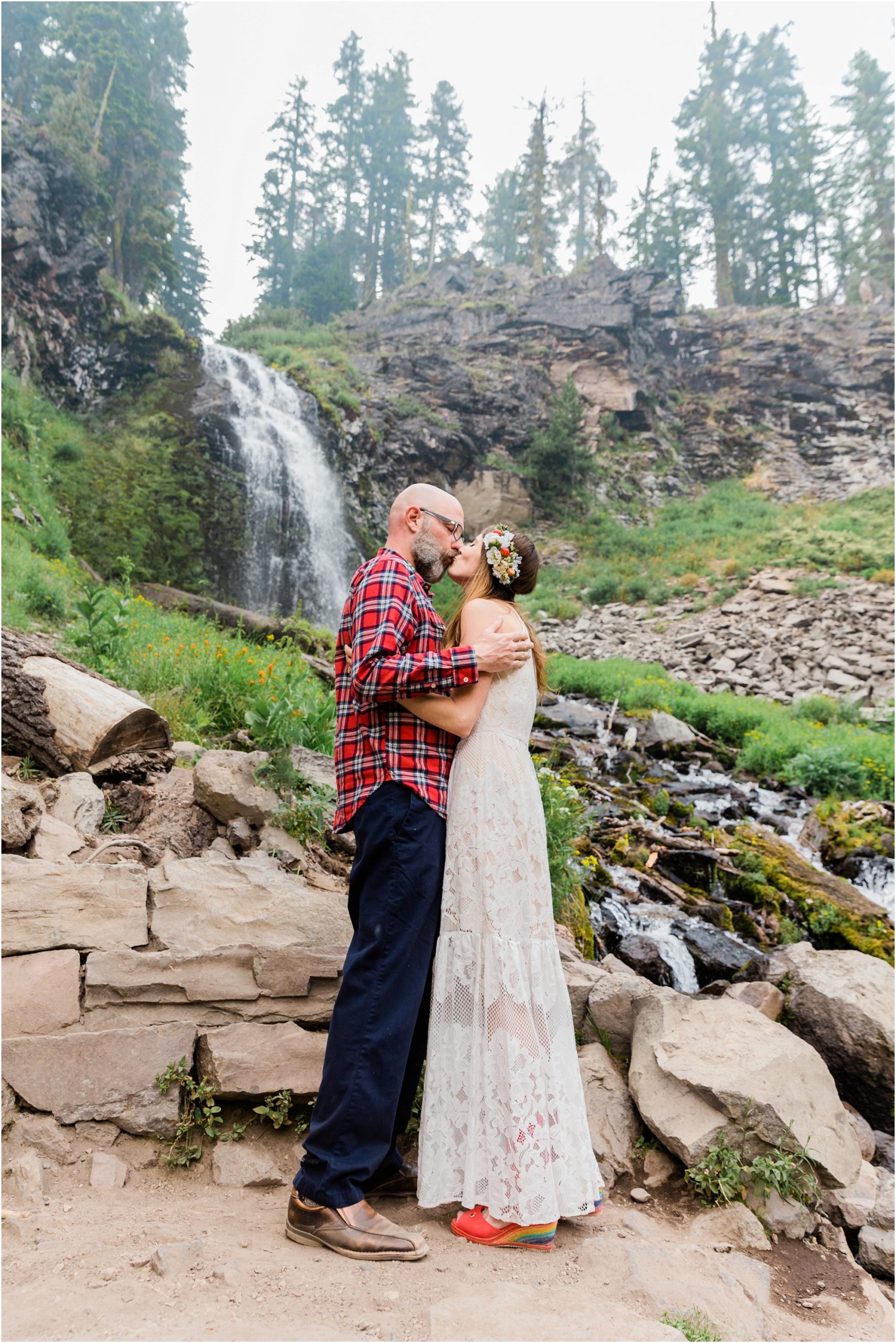 A couple exchanges their first kiss as husband and wife after their wedding ceremony at Crater Lake National Park in Oregon. | Erica Swantek Photography