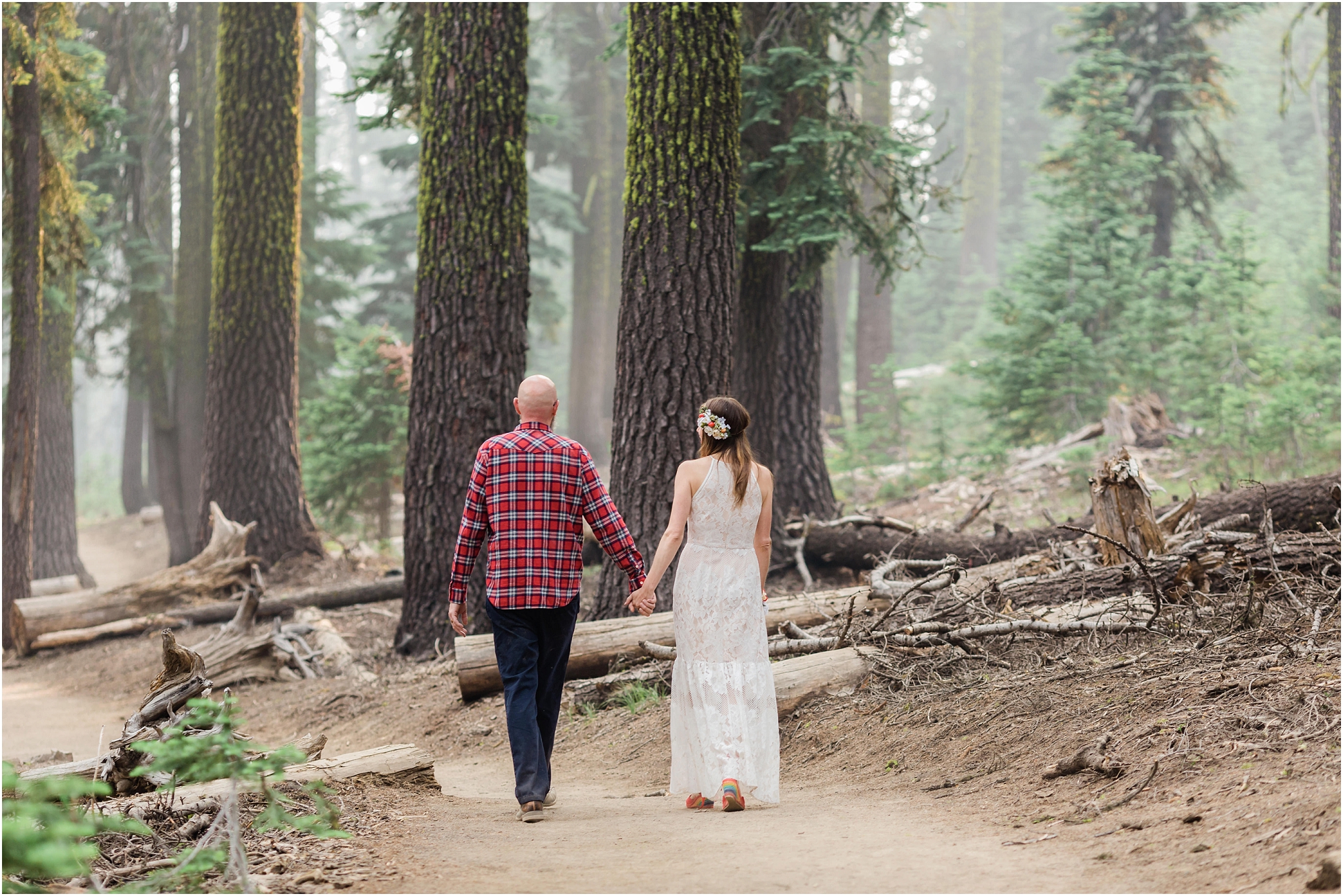 Gorgeous light along the trail as these newlyweds hike after reciting their vows during their adventurous Oregon elopement at Crater Lake. | Erica Swantek Photography