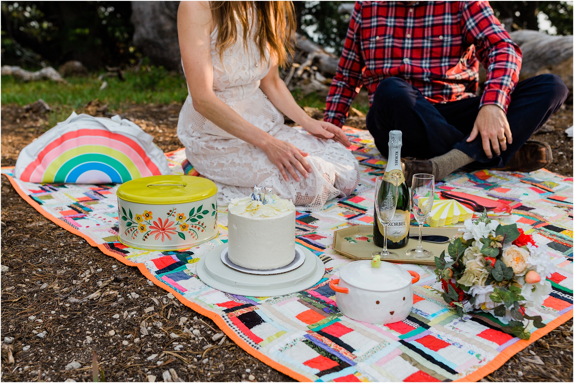 A perfect celebration of cake from Foxtail Bakery in Bend, along with strawberries and champagne, with vintage details in all colors of the rainbow, for an Oregon elopement at Crater Lake. | Erica Swantek Photography
