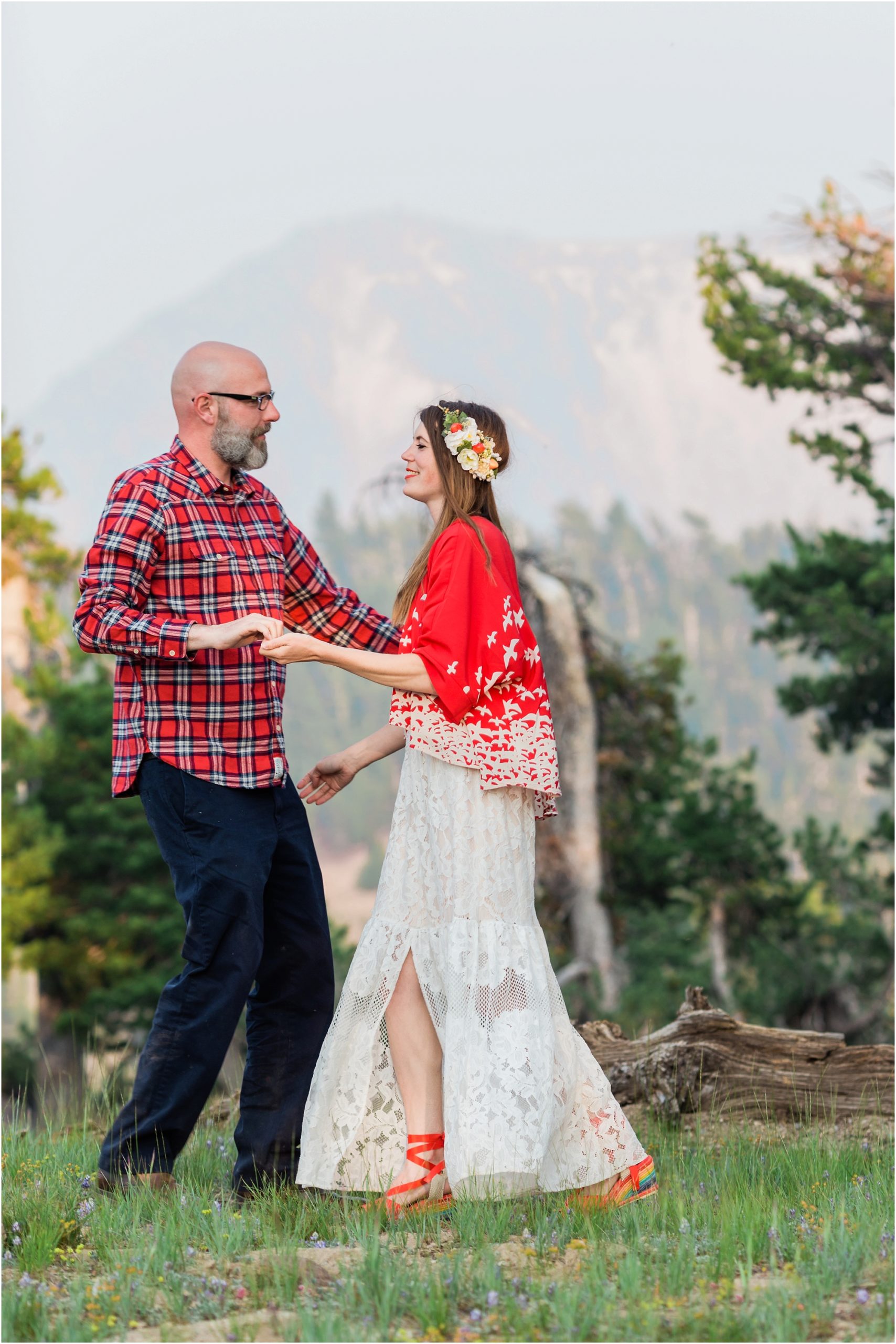 A couple practices their first dance for their romantic wedding portraits at Crater Lake in Oregon. | Erica Swantek Photography