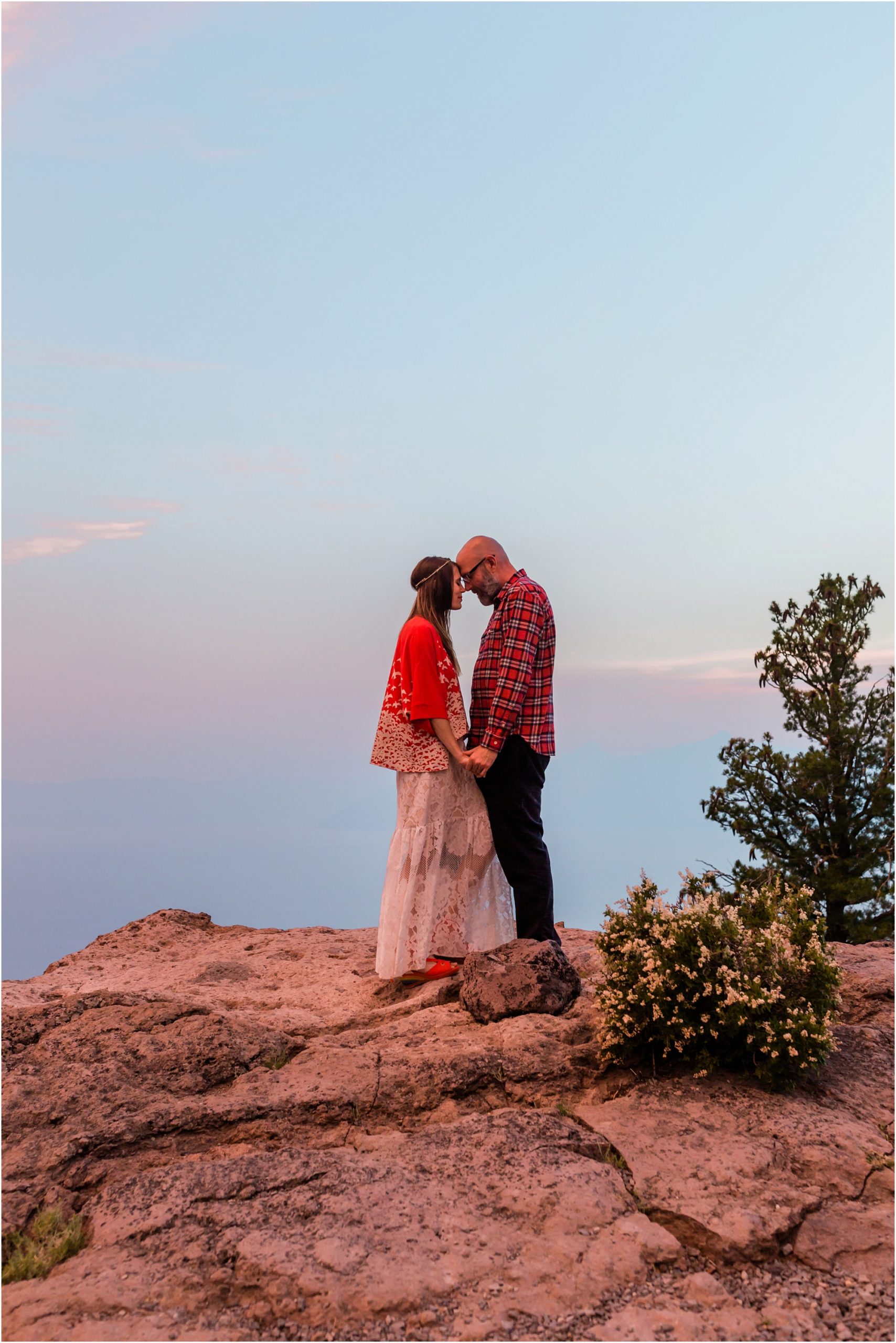 Newlyweds enjoy the magnificent sunset after their Crater Lake elopement in Oregon. | Erica Swantek Photography