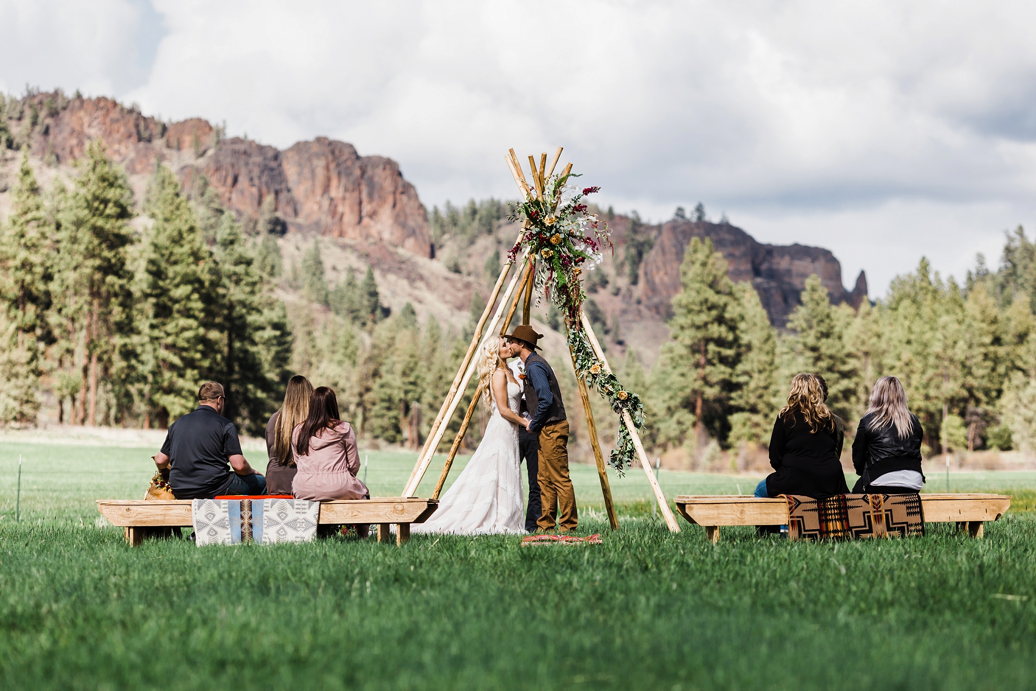 Teepee alter adorned in flowers at this intimate ceremony at the PNW elopements & weddings venue. Wine Down Ranch in Central Oregon. 