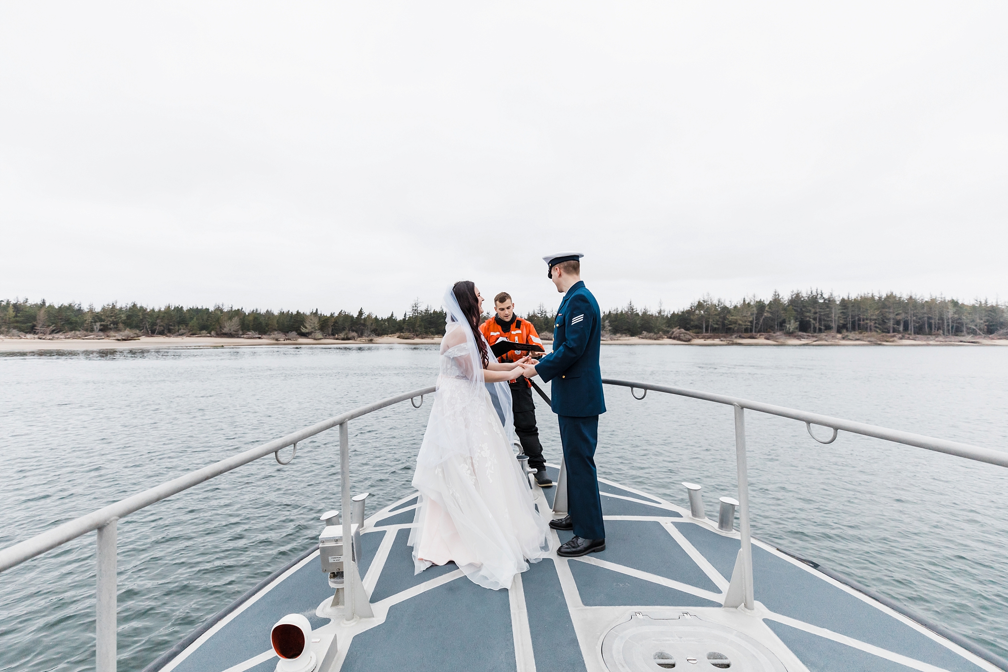An incredible elopement on a Coast Guard boat on the Oregon coast. | Erica Swantek Photography