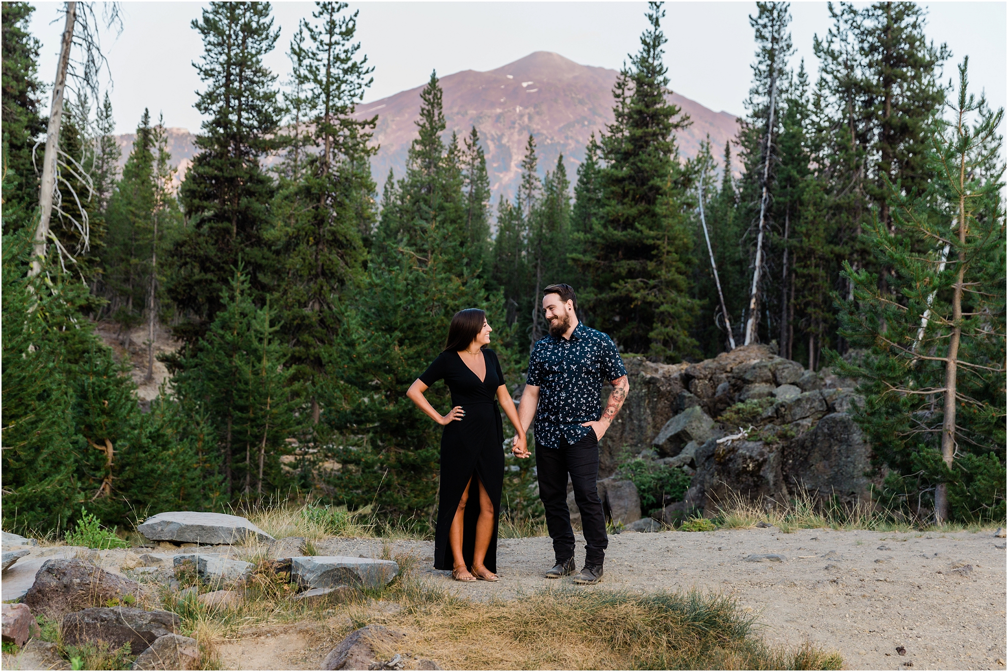 Alpenglo lights up Mt. Bachelor as a couple poses at their Sparks Lake Oregon engagement session. | Erica Swantek Photography