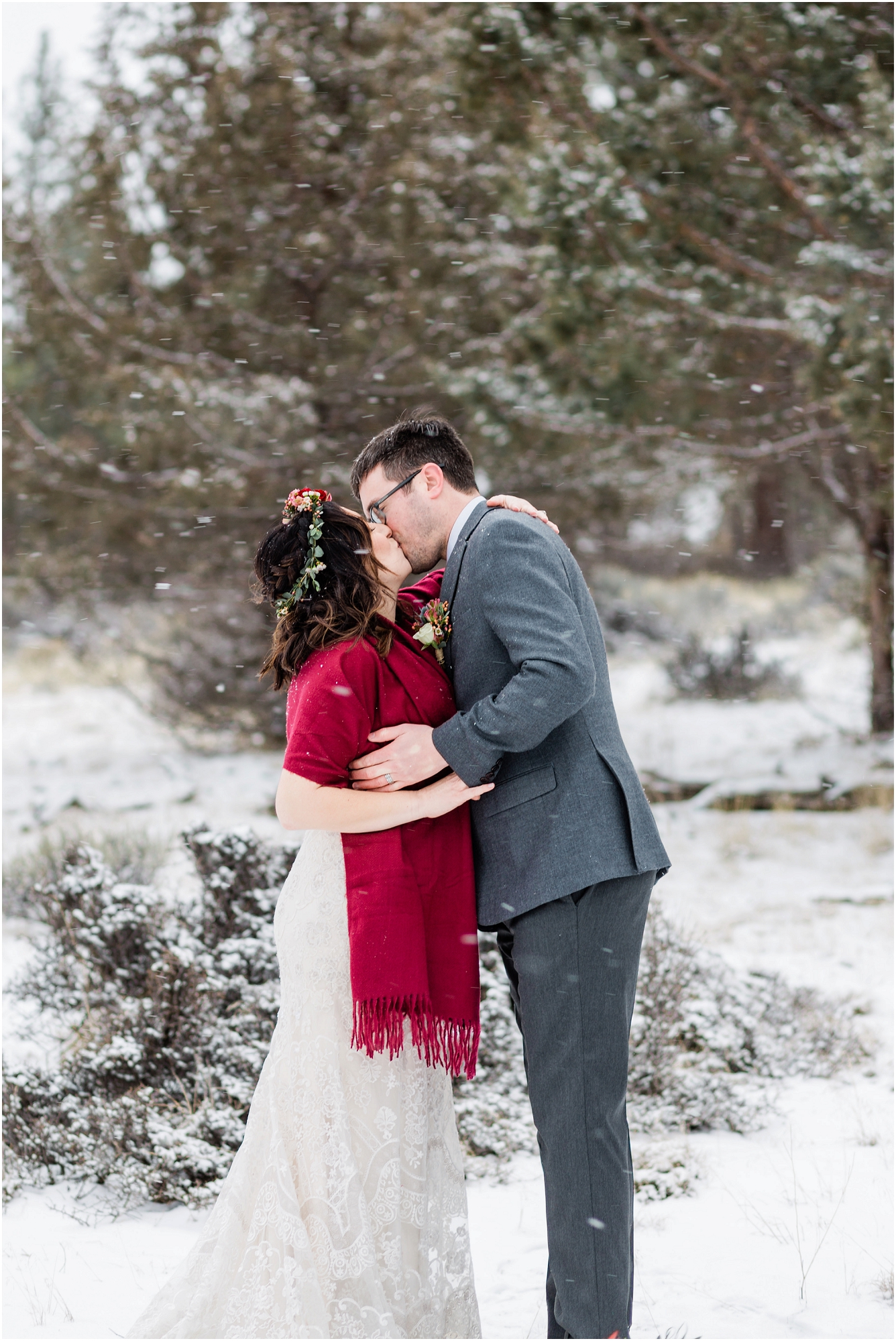 A couple's first kiss during a snowstorm at their intimate Central Oregon winter elopement near Five Pine Lodge in Sisters, Oregon. | Erica Swantek Photography