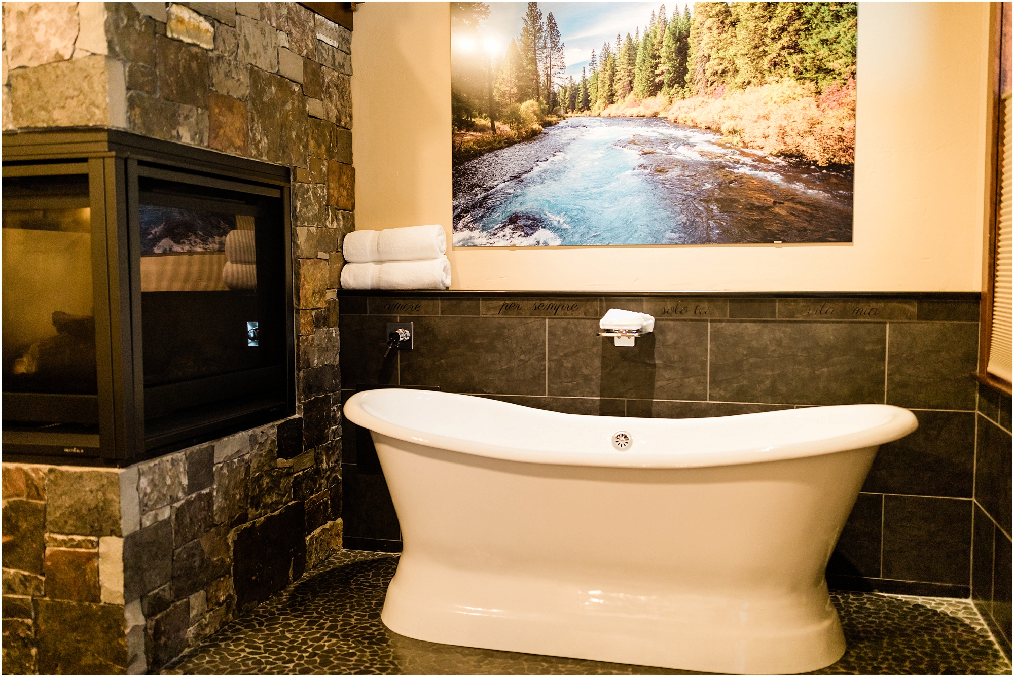 A soaking tub big enough for two next to a fireplace is the perfect romantic touch for a couple's Central Oregon winter elopement at Five Pine Lodge in Sisters. | Erica Swantek Photography