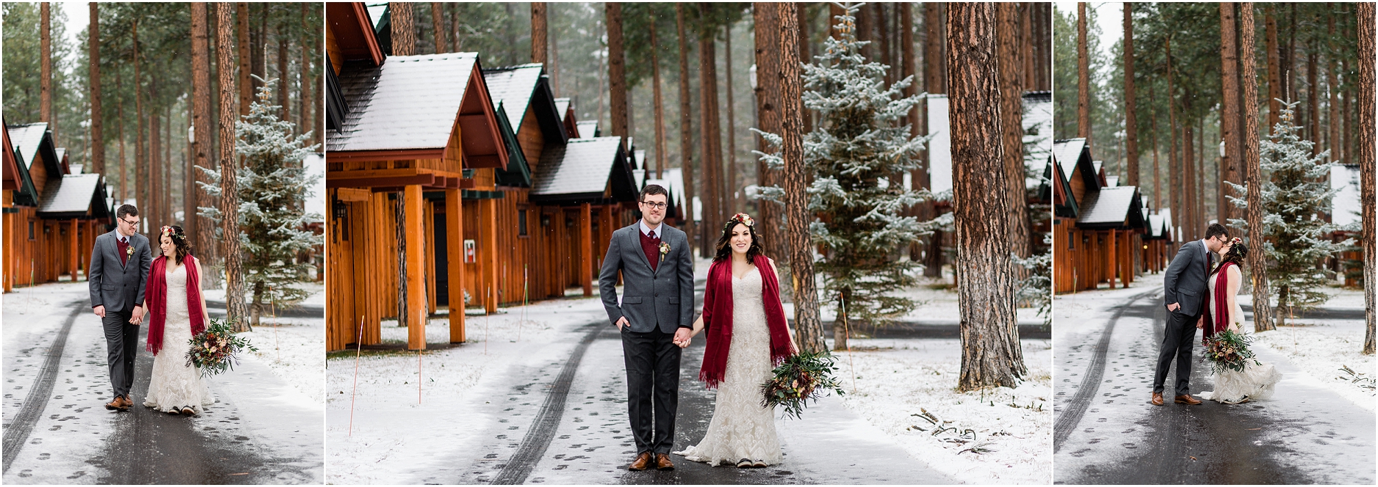 A bride, wearing a floral crown and red shawl over her white dress and a groom, wearing a gray and burgundy suit, walk hand in hand along a snow covered walkway with her bouquet hangs from her other hand at Five Pine Lodge for their Central Oregon winter elopement. | Erica Swantek Photography 
