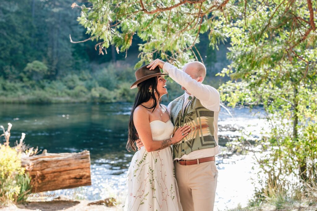 bride and groom laughing and having fun during their bend oregon elopement