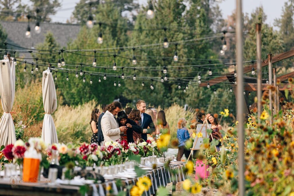 rainshadow organics farm wedding reception set up outdoors surrounded by lush flower fields